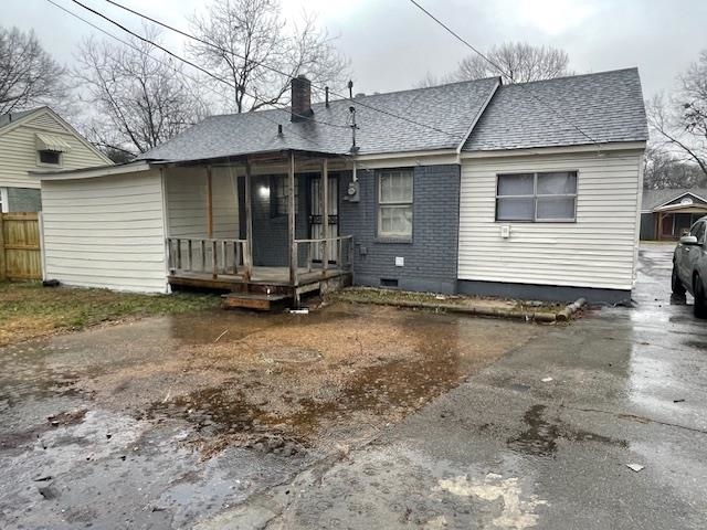 1185 Wright Road Memphis, TN 38122 - Photo 2 of 10 Rear view of property with a chimney, a shingled roof, and a wooden deck