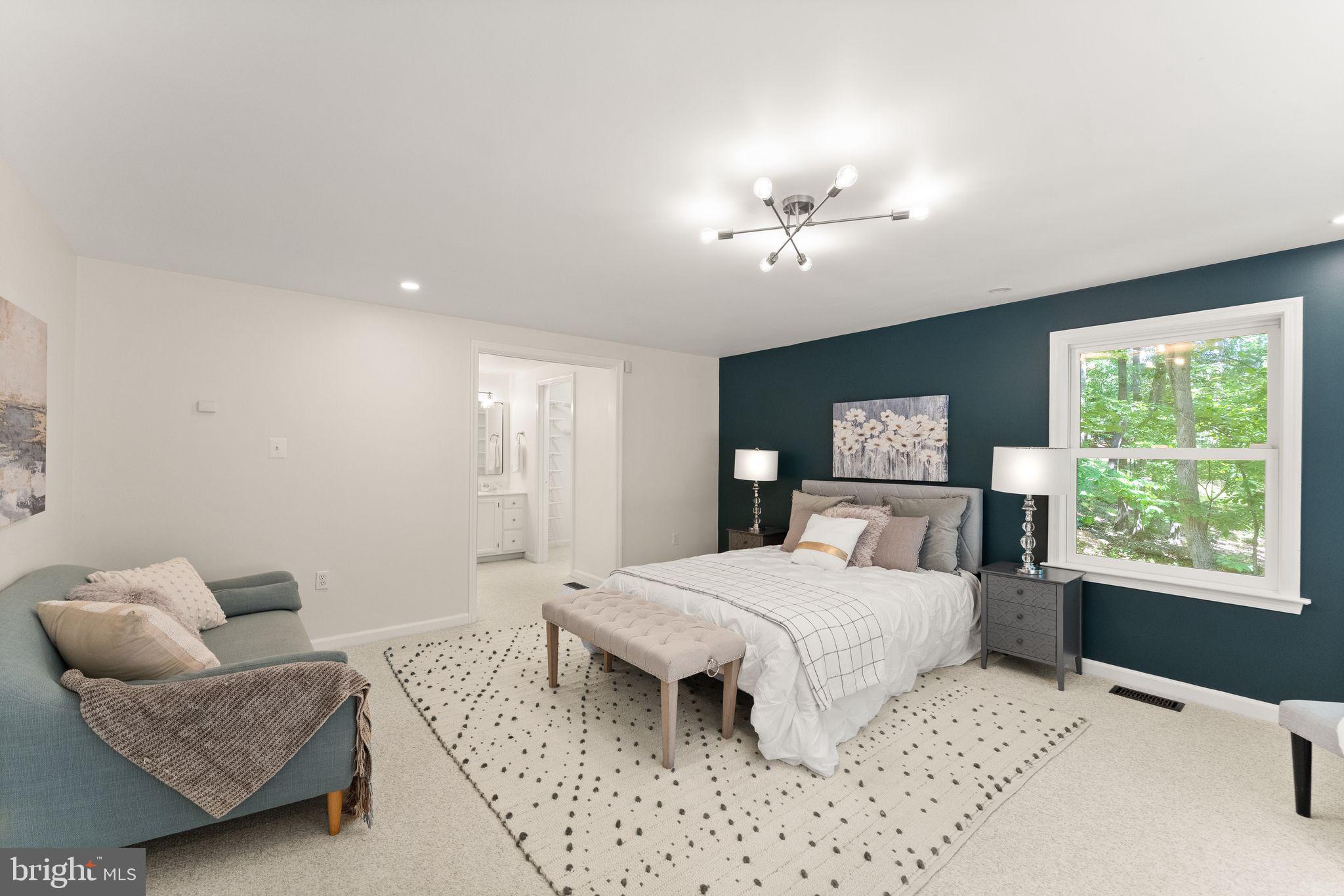38620 Lime Kiln Road Leesburg, VA 20175 - Photo 28 of 87 a bedroom with a large bed couch and windows