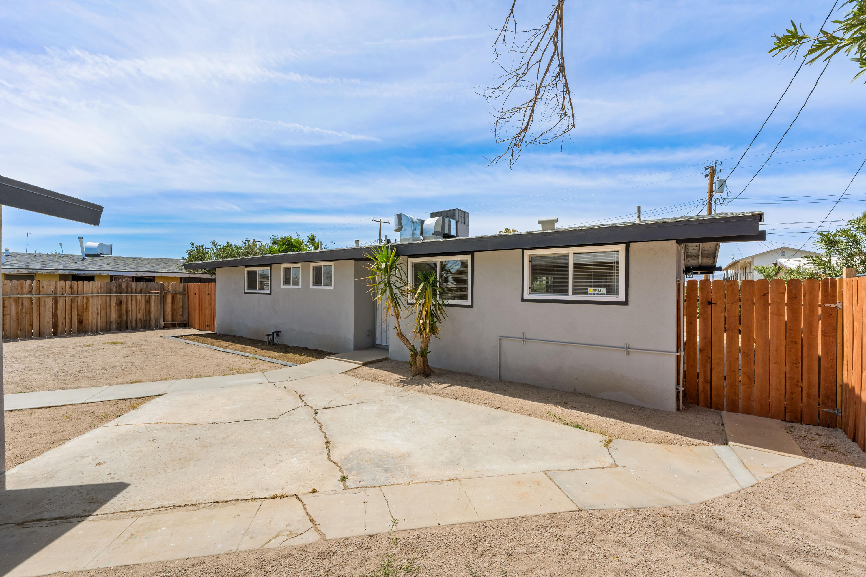 15593 M Street Mojave, CA 93501 - Photo 17 of 53 a backyard of a house with wooden fence