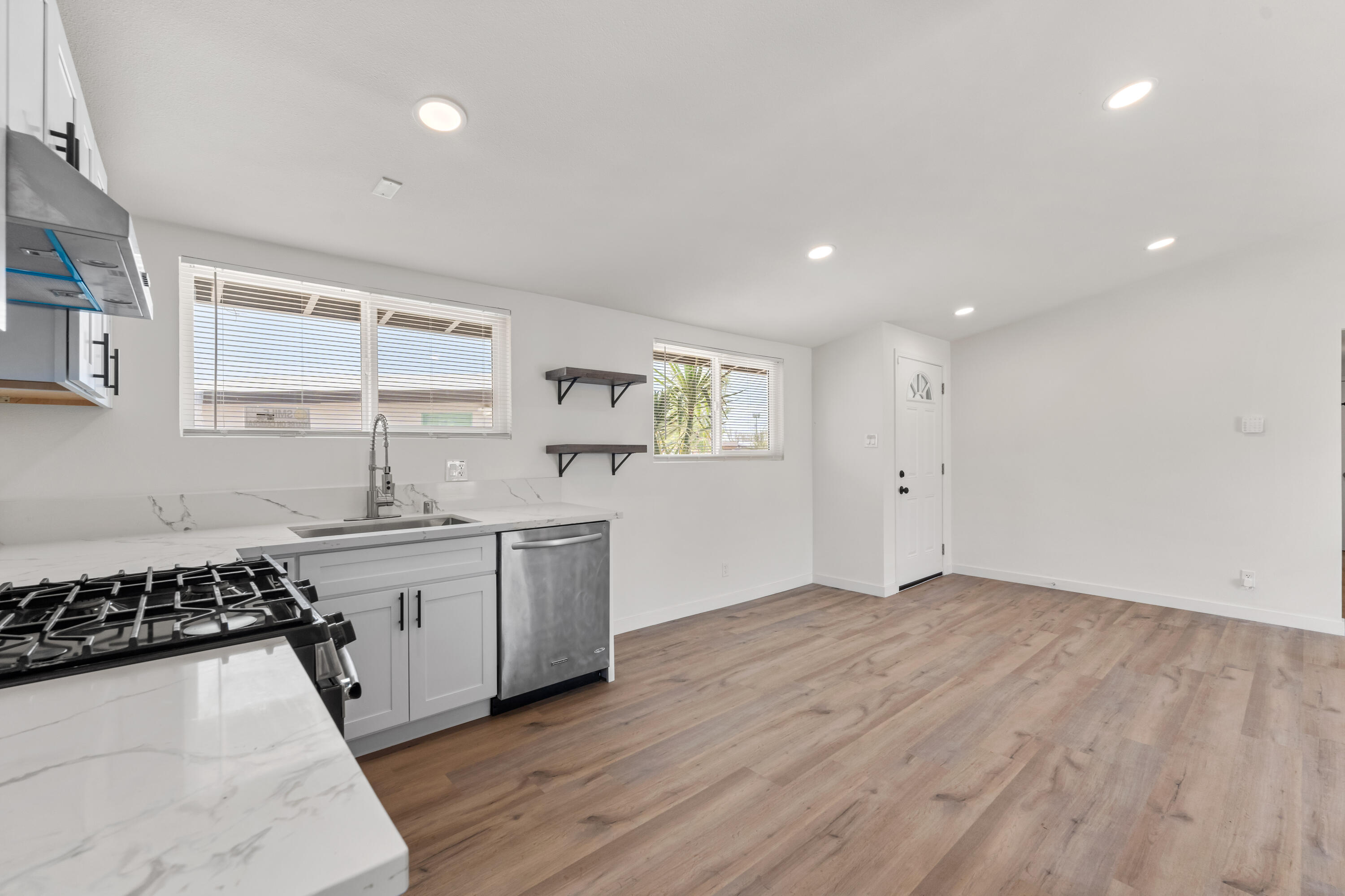 15593 M Street Mojave, CA 93501 - Photo 21 of 53 a kitchen with a sink stove and cabinets