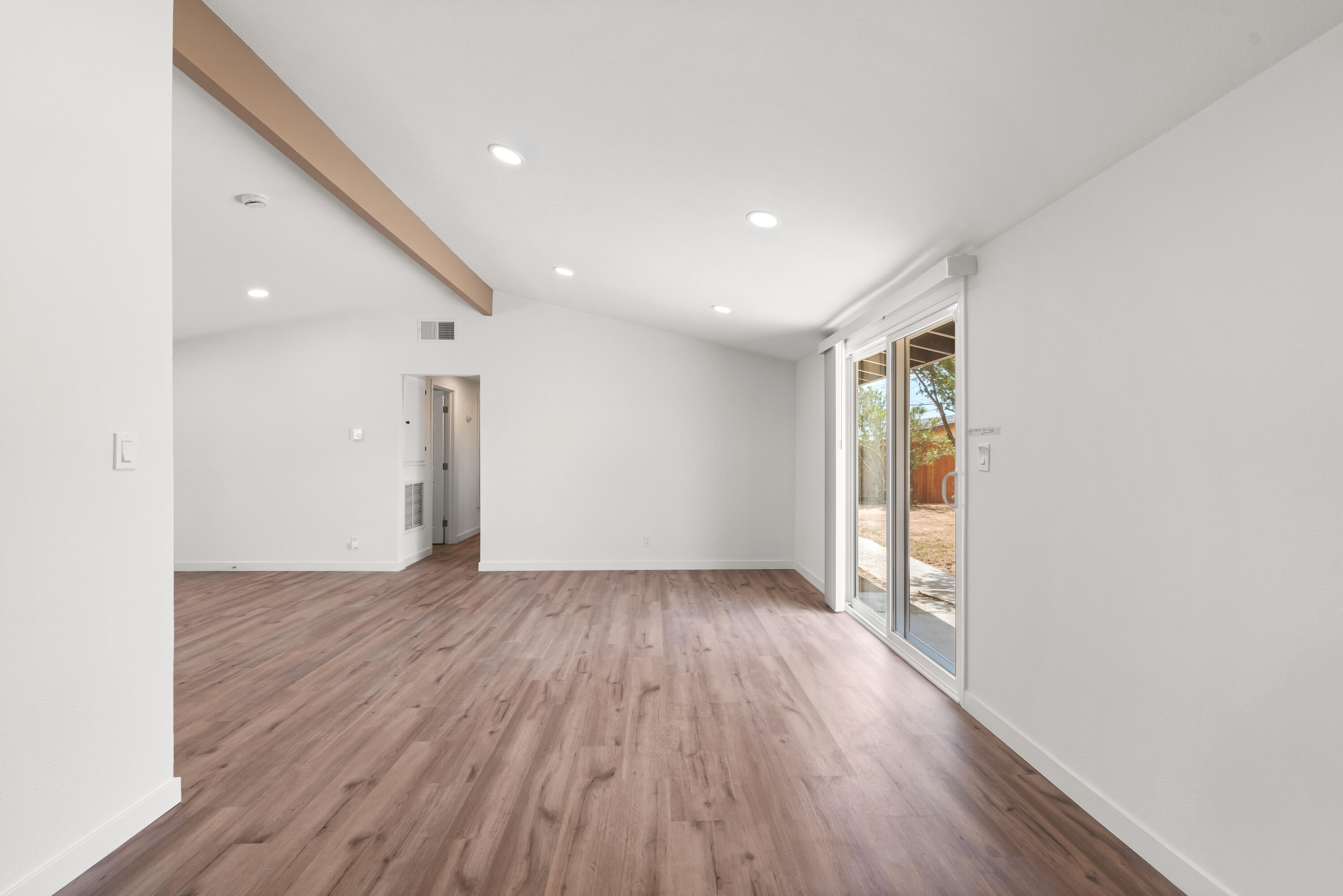 15593 M Street Mojave, CA 93501 - Photo 26 of 53 a view of an empty room with wooden floor and a window