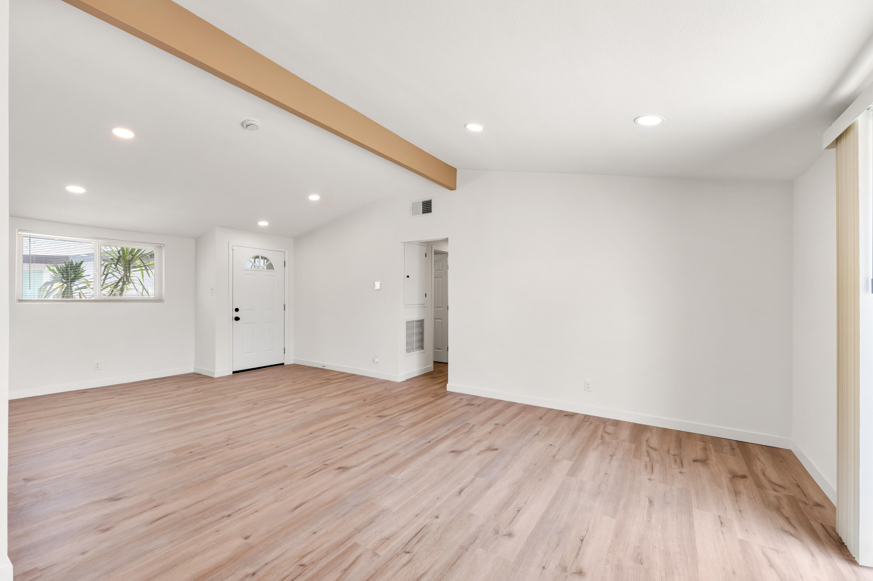 15593 M Street Mojave, CA 93501 - Photo 27 of 53 an empty room with wooden floor and window