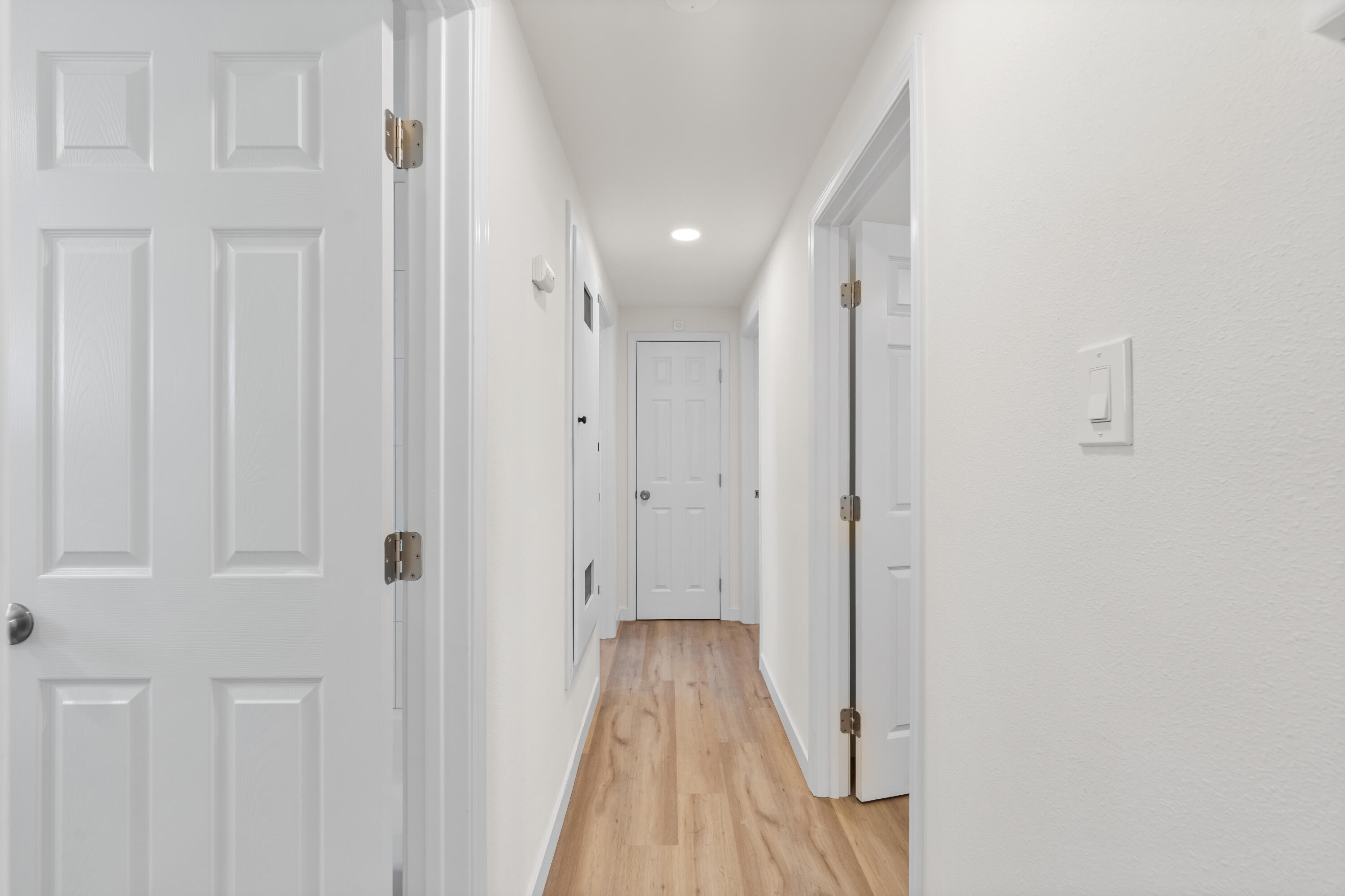 15593 M Street Mojave, CA 93501 - Photo 28 of 53 a view of a hallway with wooden floor and staircase