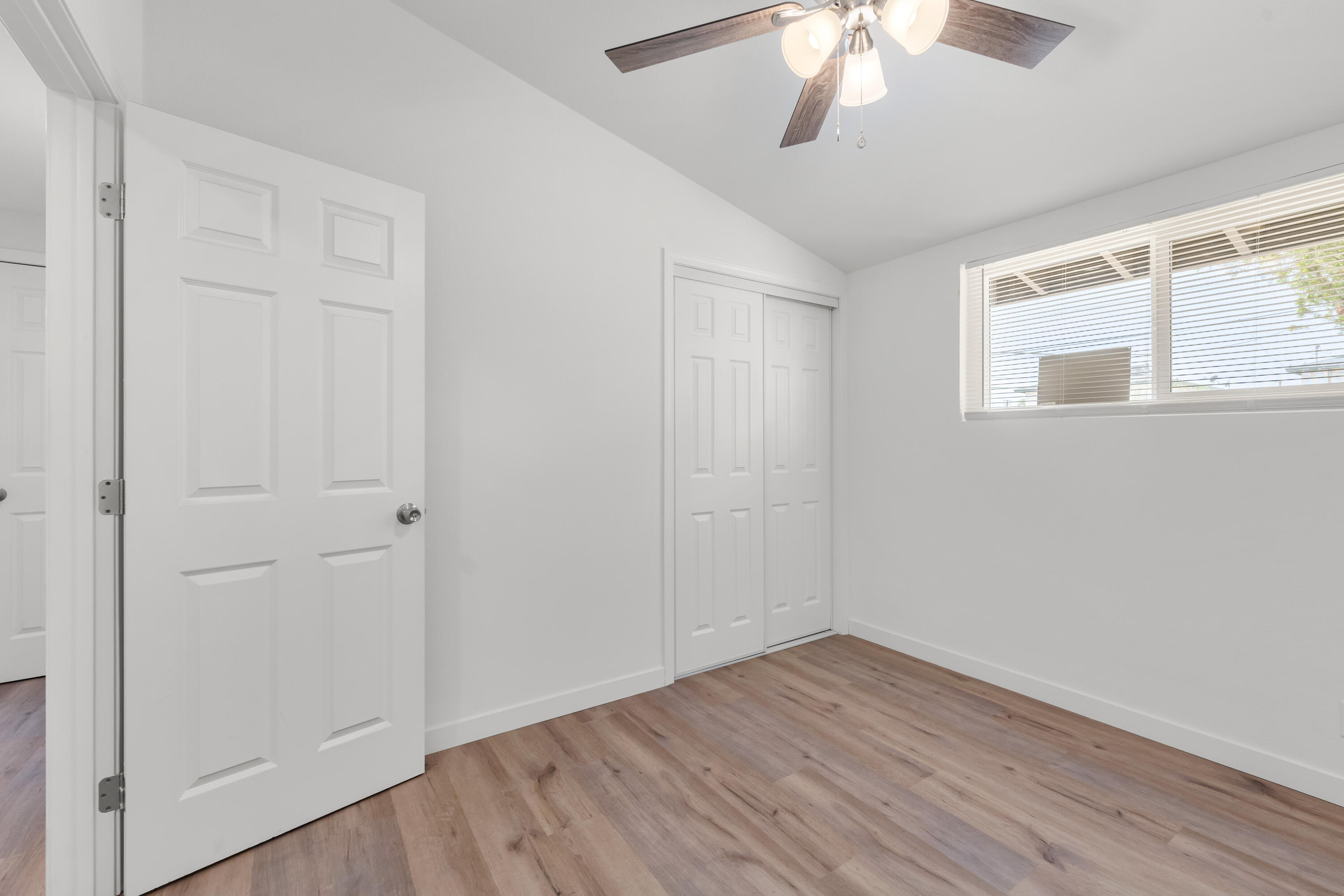 15593 M Street Mojave, CA 93501 - Photo 30 of 53 a view of an empty room with wooden floor and a window