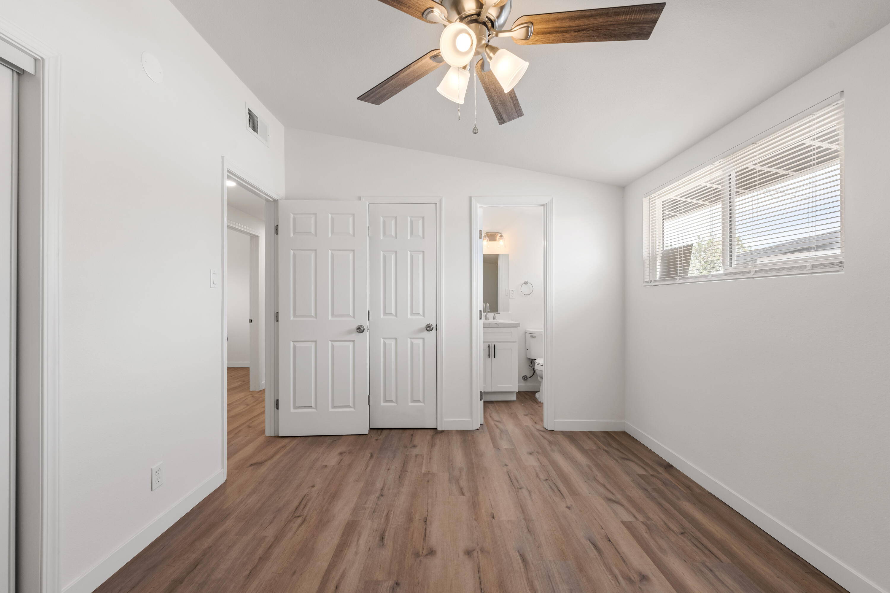 15593 M Street Mojave, CA 93501 - Photo 37 of 53 wooden floor in an empty room with a window