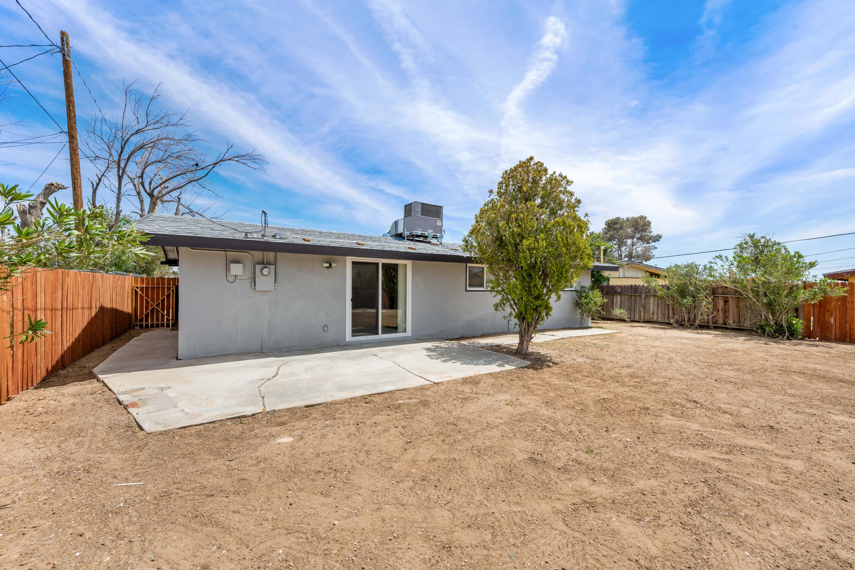 15593 M Street Mojave, CA 93501 - Photo 40 of 53 a view of a house with a yard and garage