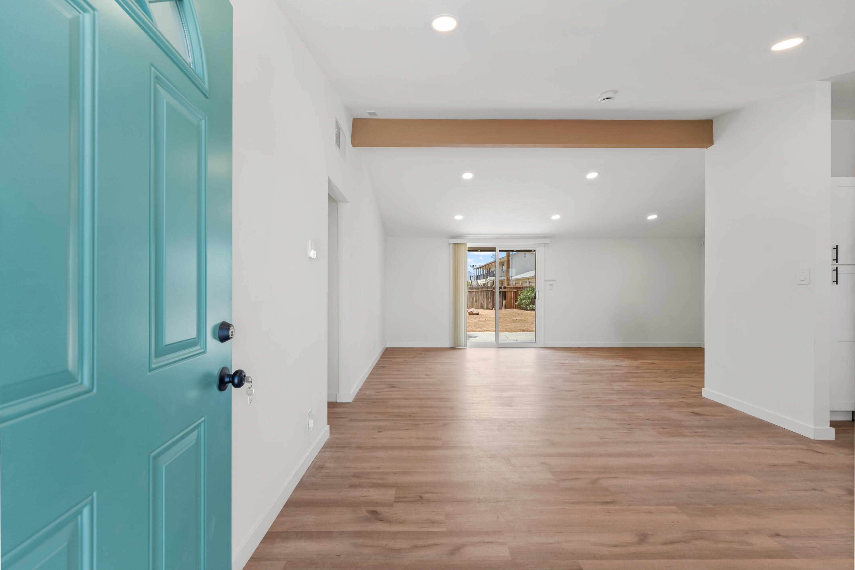 15593 M Street Mojave, CA 93501 - Photo 4 of 53 a view of a hallway with wooden floor