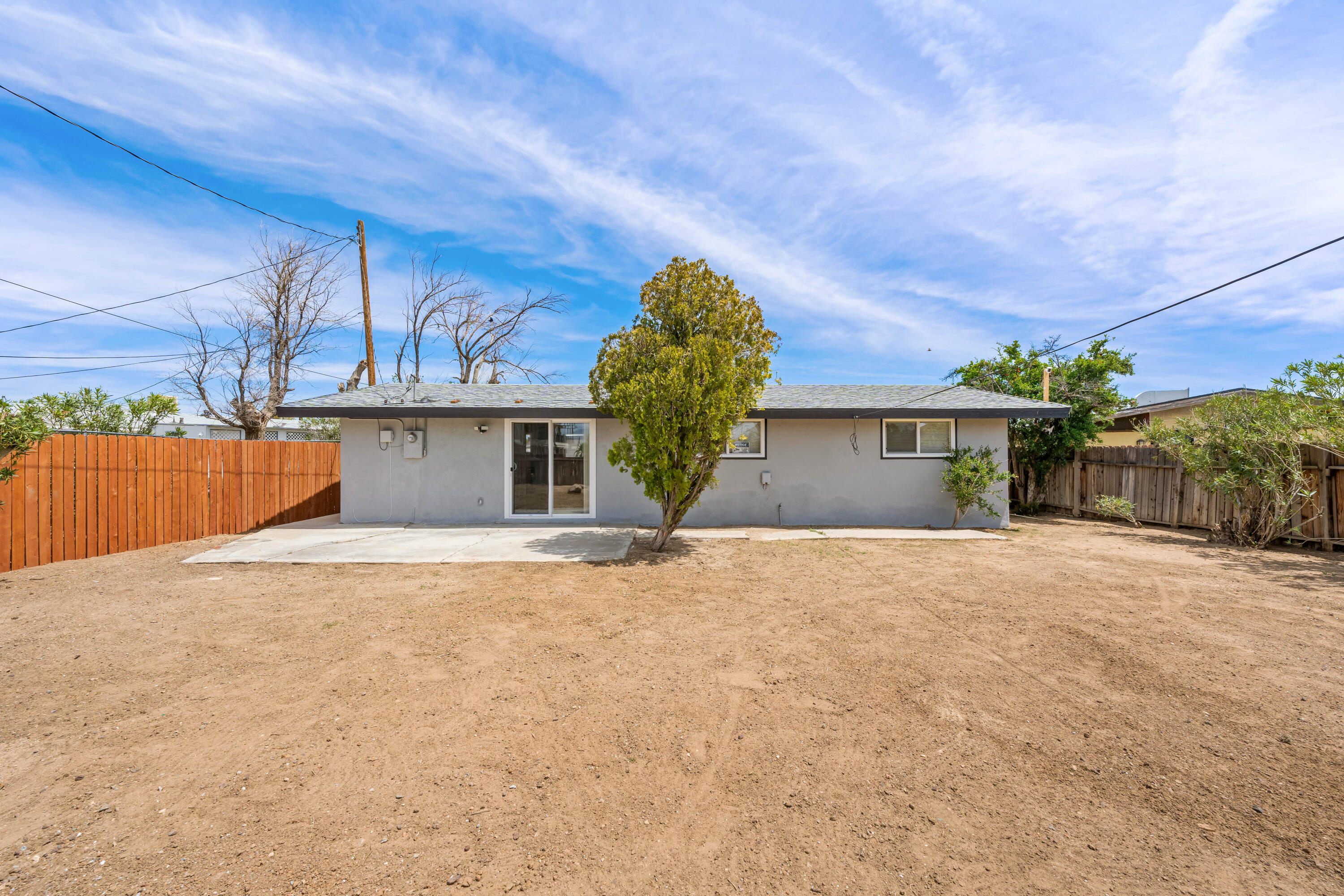15593 M Street Mojave, CA 93501 - Photo 42 of 53 a view of a house with a yard and garage