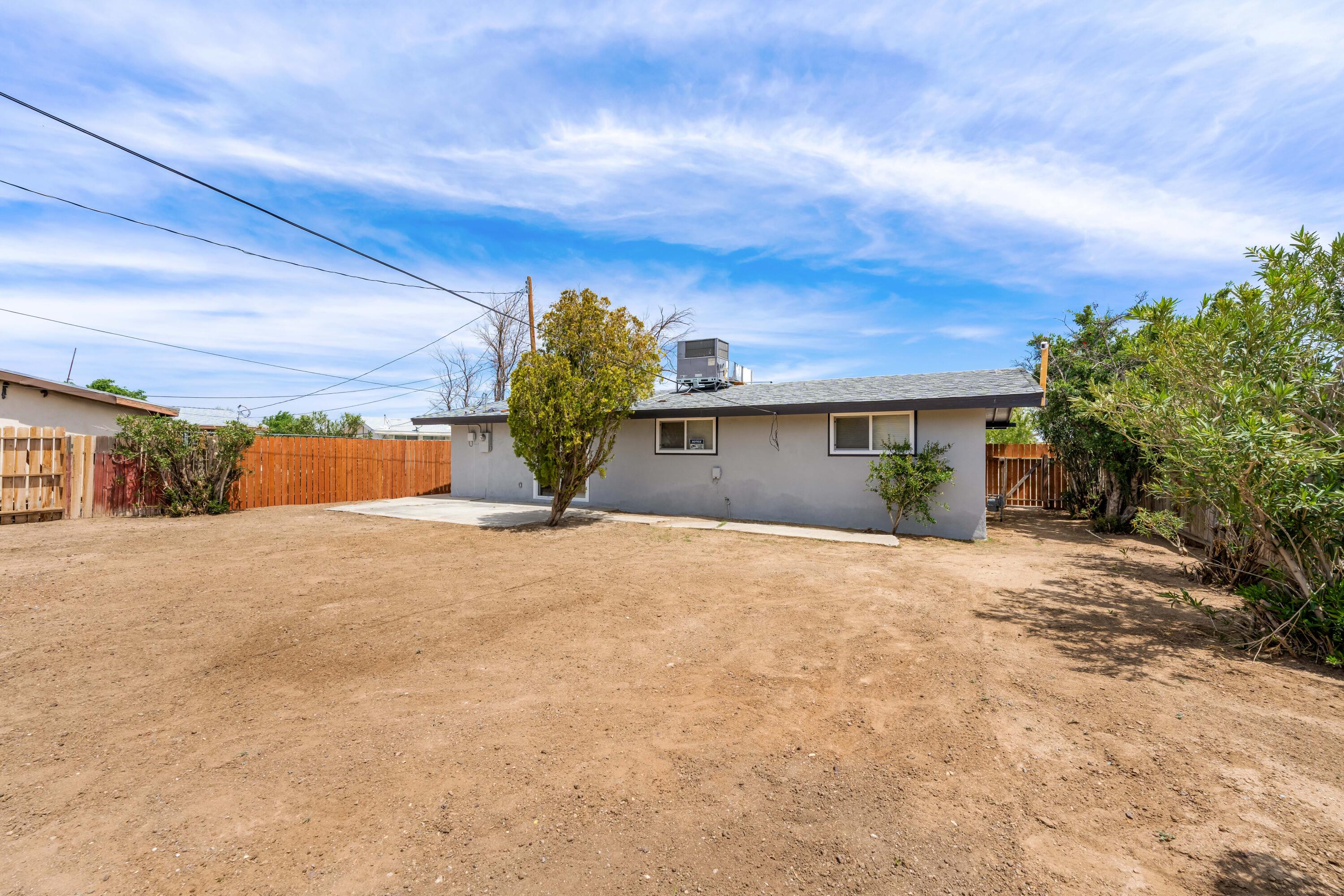 15593 M Street Mojave, CA 93501 - Photo 43 of 53 a view of a house with a yard and garage