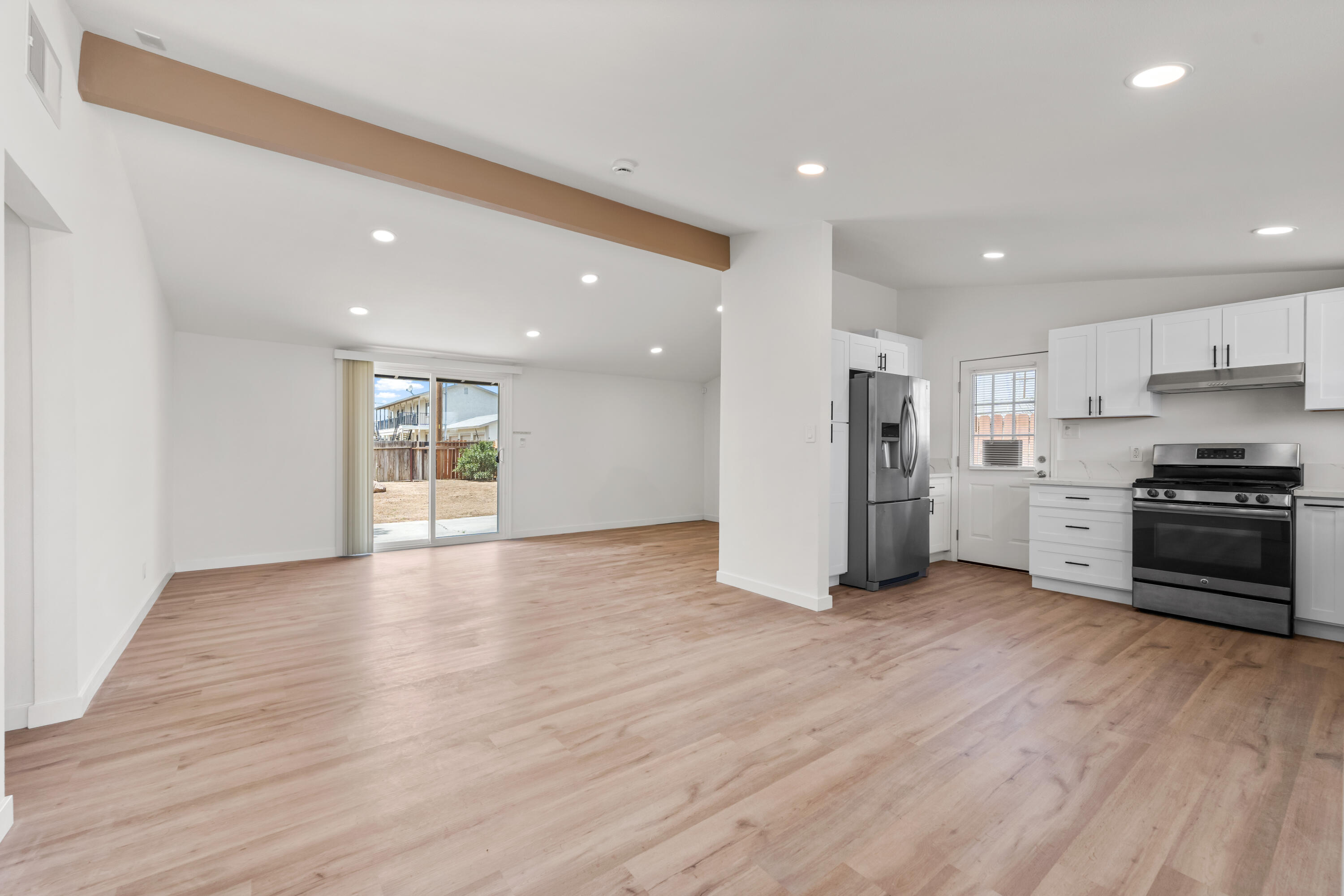 15593 M Street Mojave, CA 93501 - Photo 5 of 53 a view of kitchen with refrigerator and microwave