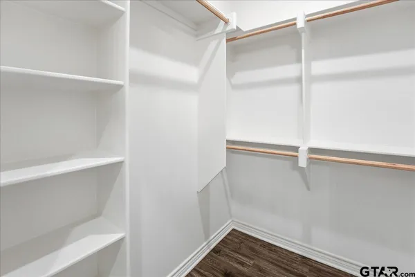 a view of an empty walk in closet