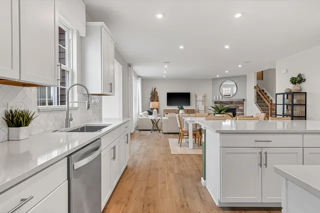a kitchen with lots of counter and sink