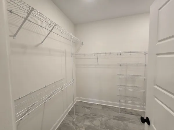 a view of a room with racks on the wall