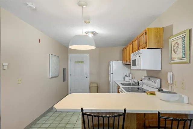 $850,000 | 115 Weirs Road, Unit 109B, Gilford, NH 03249