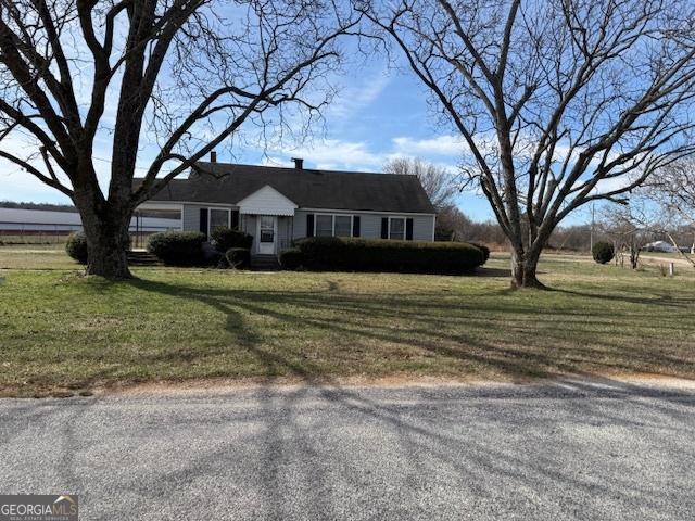 661 Seed Cleaner Road Hartwell, GA 30643 - Photo 1 of 1 a front view of a house with a yard