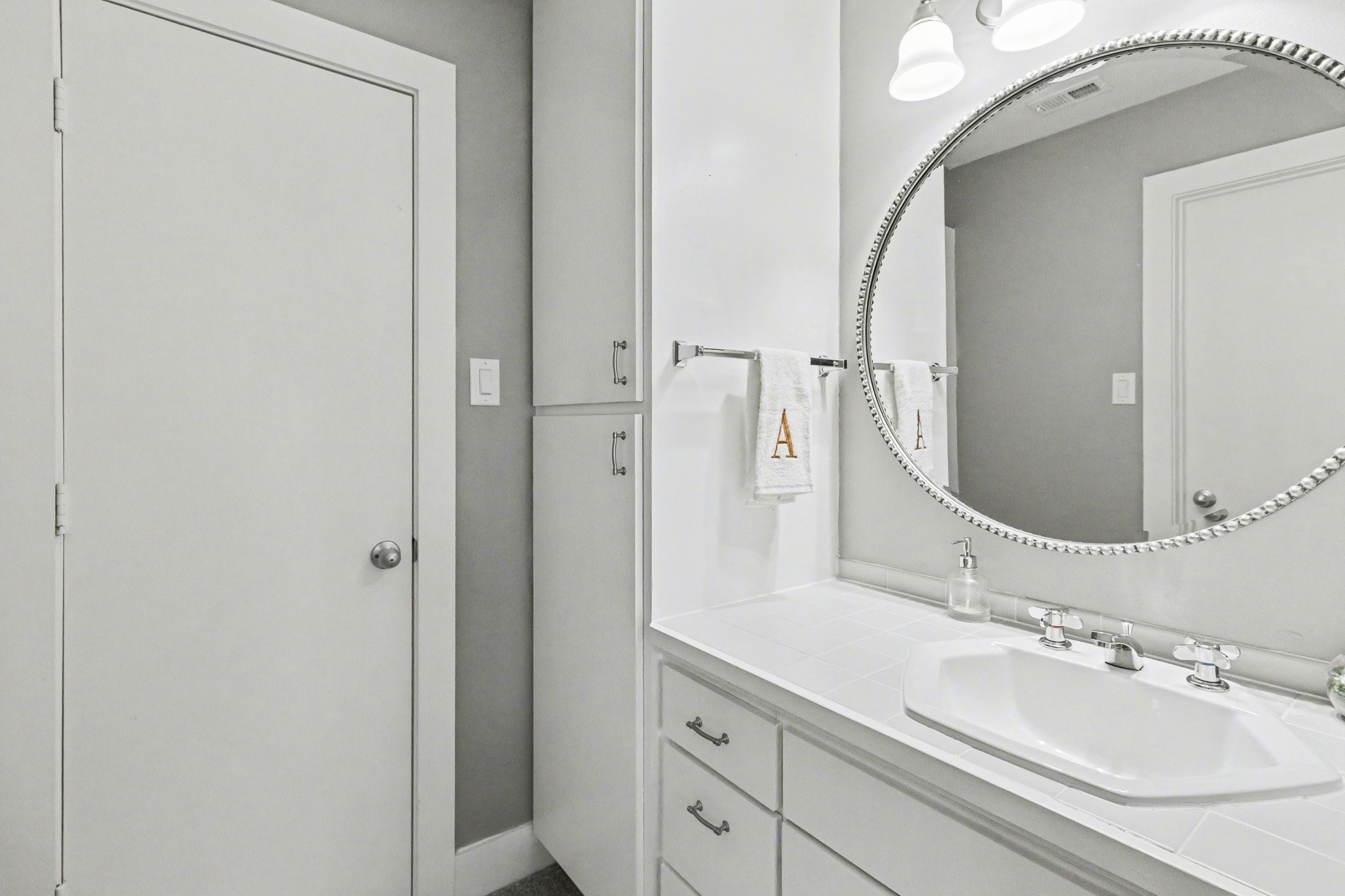 914 West 25th Street, Unit 2 Houston, TX 77008 - Photo 18 of 30 a bathroom with a granite countertop sink and a mirror