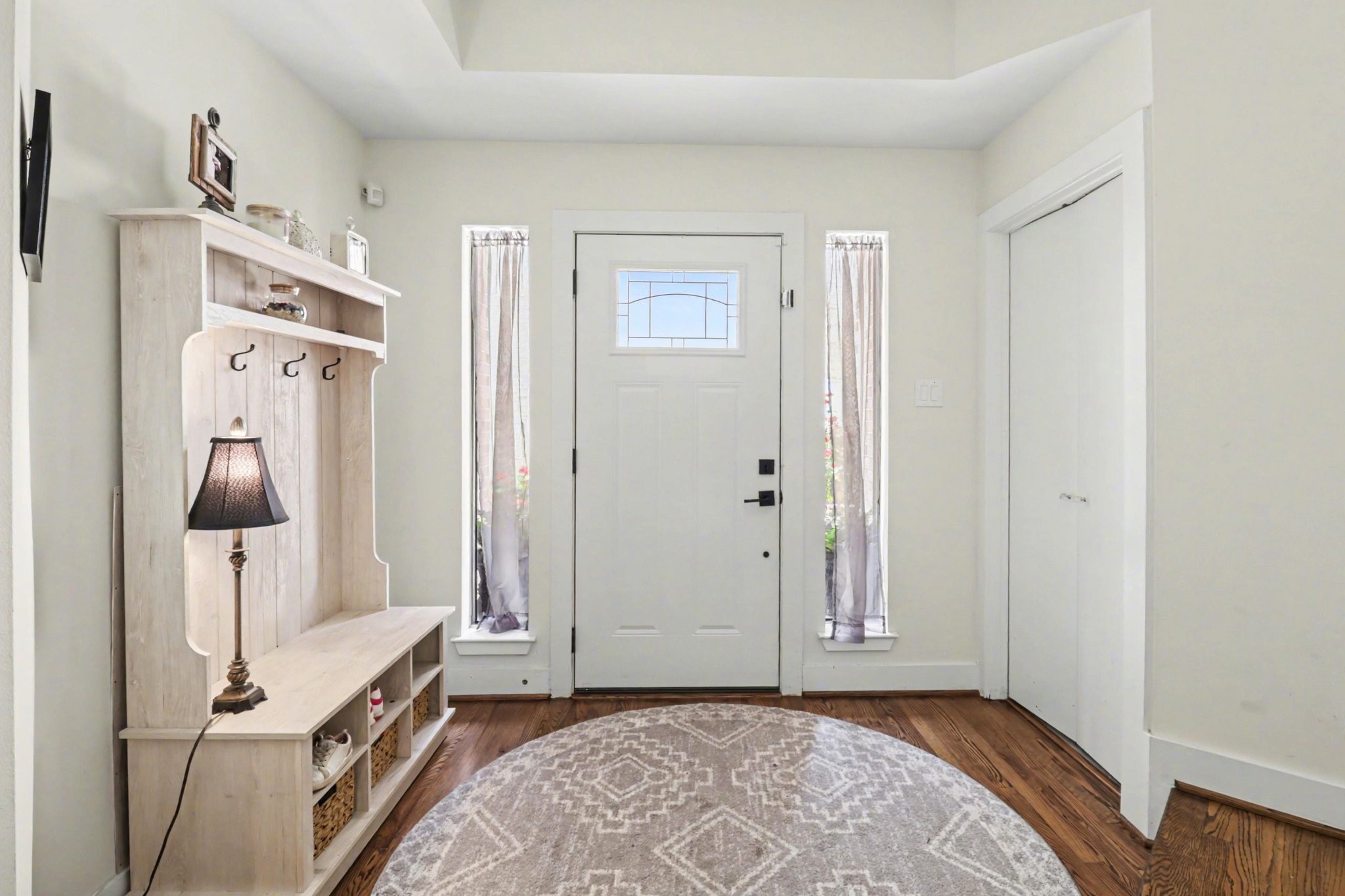 914 West 25th Street, Unit 2 Houston, TX 77008 - Photo 3 of 30 a view of a bedroom with wooden floor and white walls