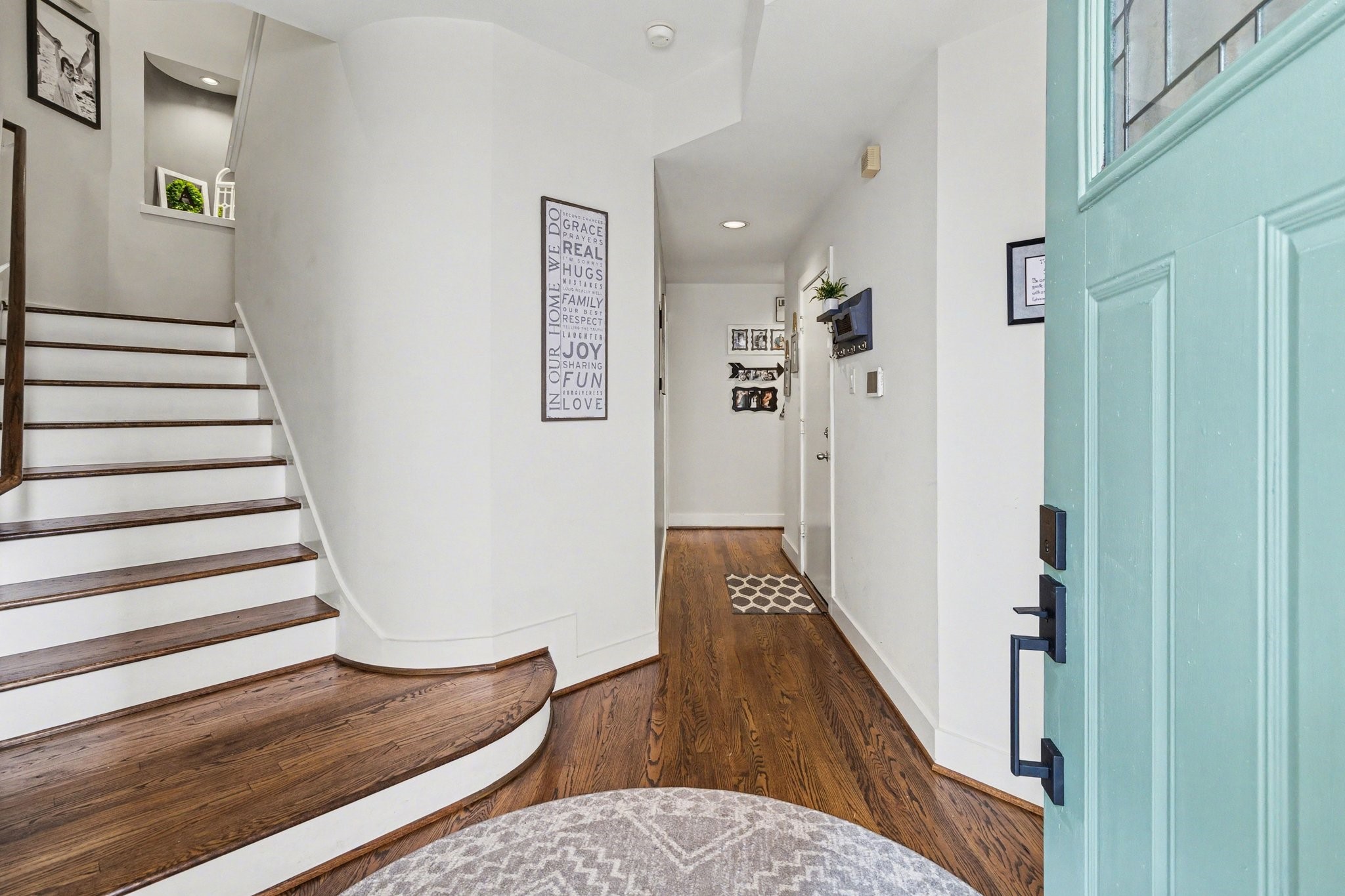 914 West 25th Street, Unit 2 Houston, TX 77008 - Photo 4 of 30 a view of a hallway with wooden floor and staircase