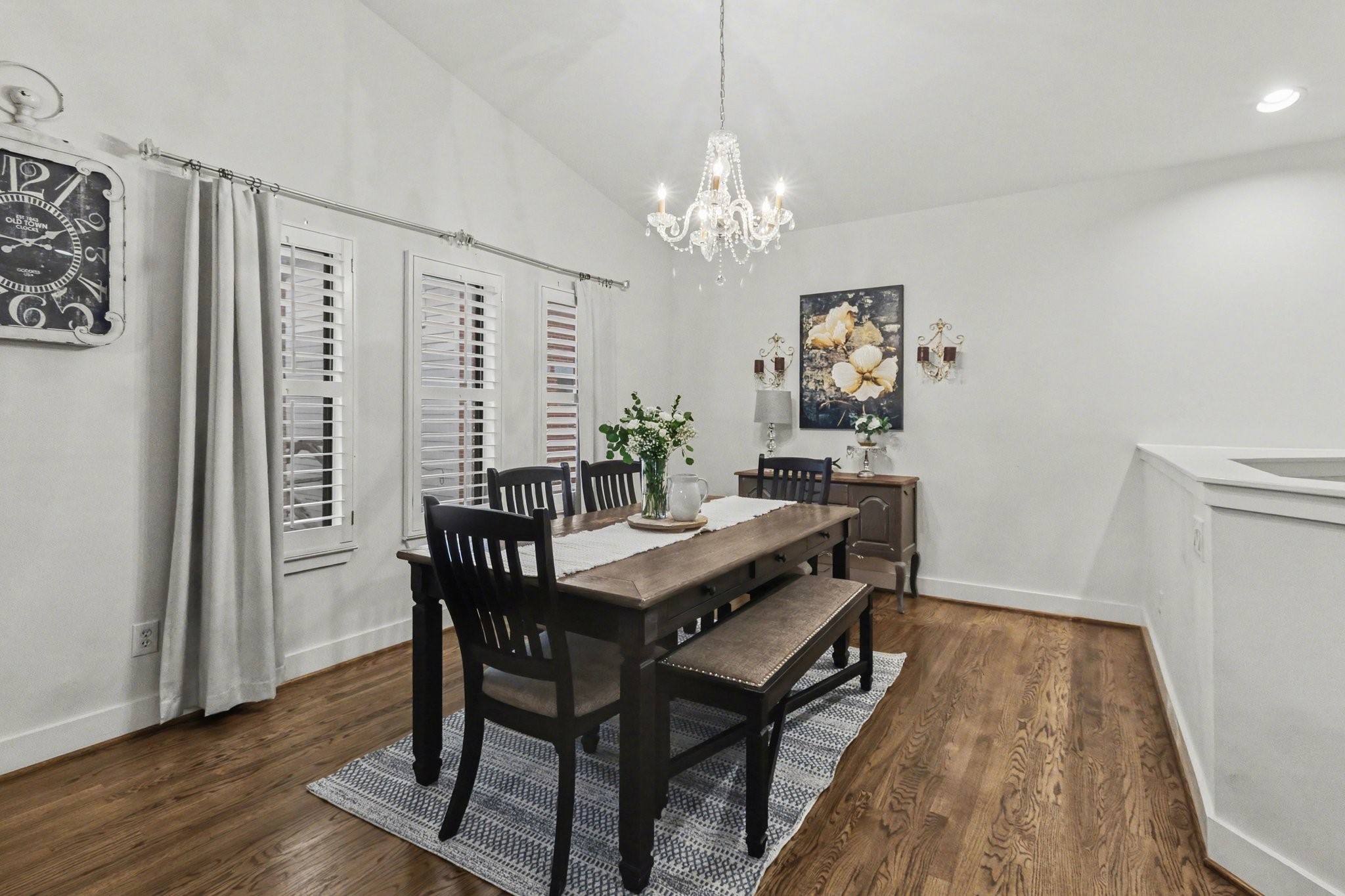 914 West 25th Street, Unit 2 Houston, TX 77008 - Photo 10 of 30 a view of a dining room with furniture a chandelier and wooden floor