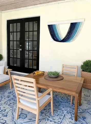 a view of a dining room with furniture and window