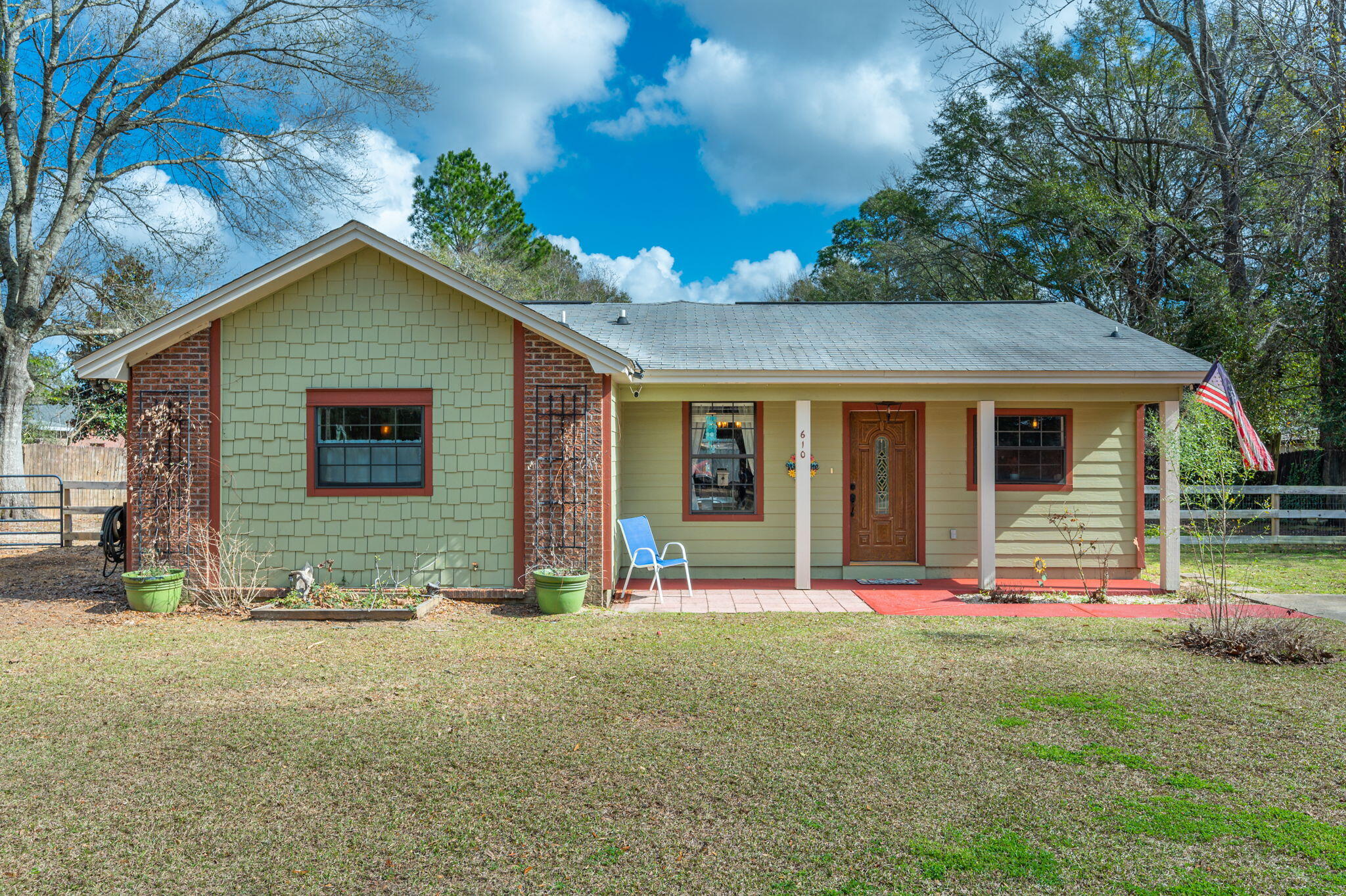 a front view of a house with a yard