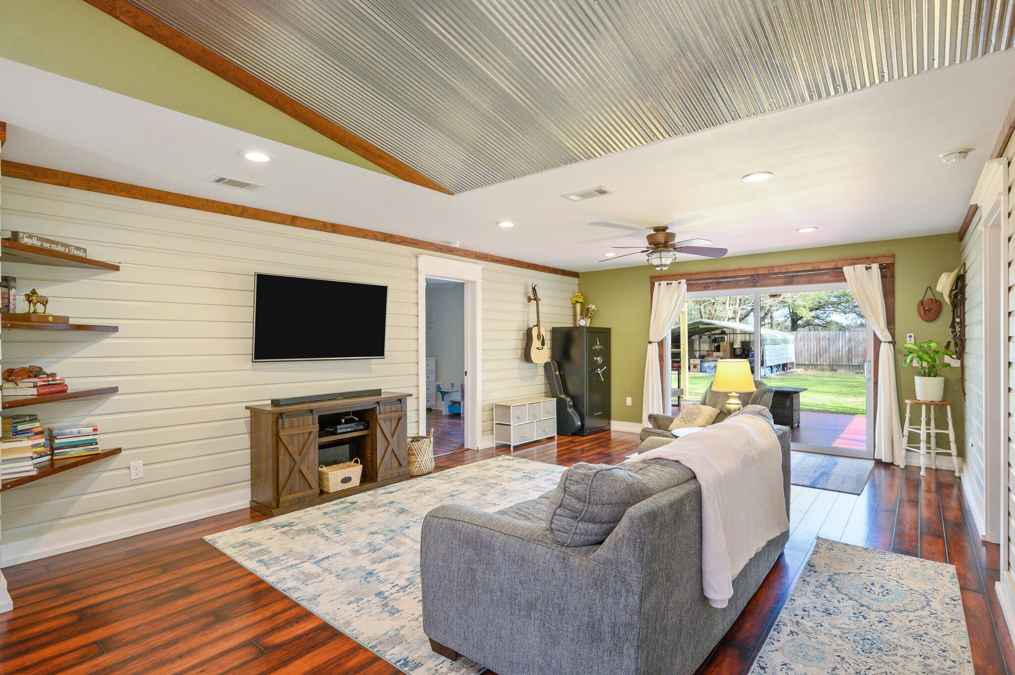 610 Jones Road Crestview, FL 32536 - Photo 11 of 39 a living room with fireplace furniture and a flat screen tv