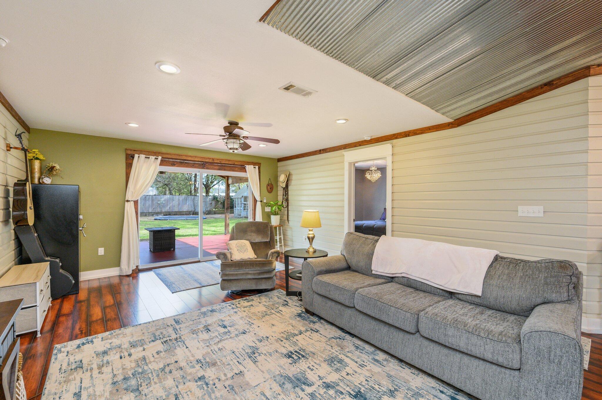 610 Jones Road Crestview, FL 32536 - Photo 12 of 39 a living room with furniture flat screen tv and a large window