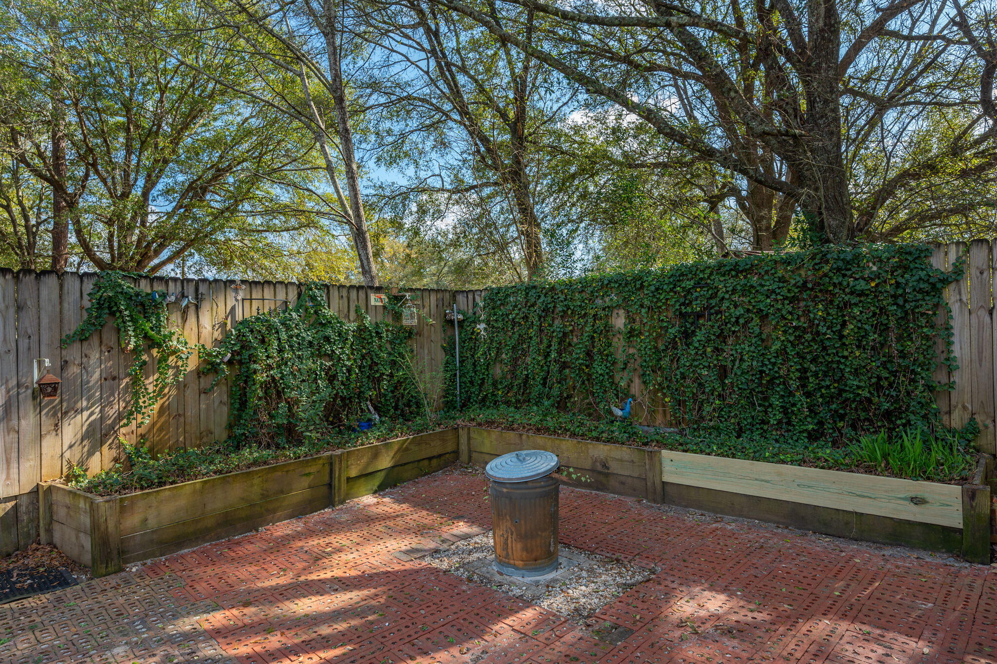 610 Jones Road Crestview, FL 32536 - Photo 19 of 39 a view of a backyard with plants and lake view