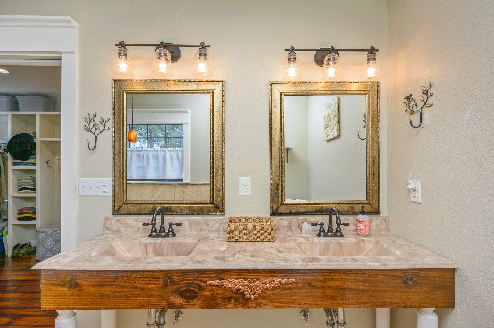 610 Jones Road Crestview, FL 32536 - Photo 20 of 39 a bathroom with double vanity sinks and a mirror