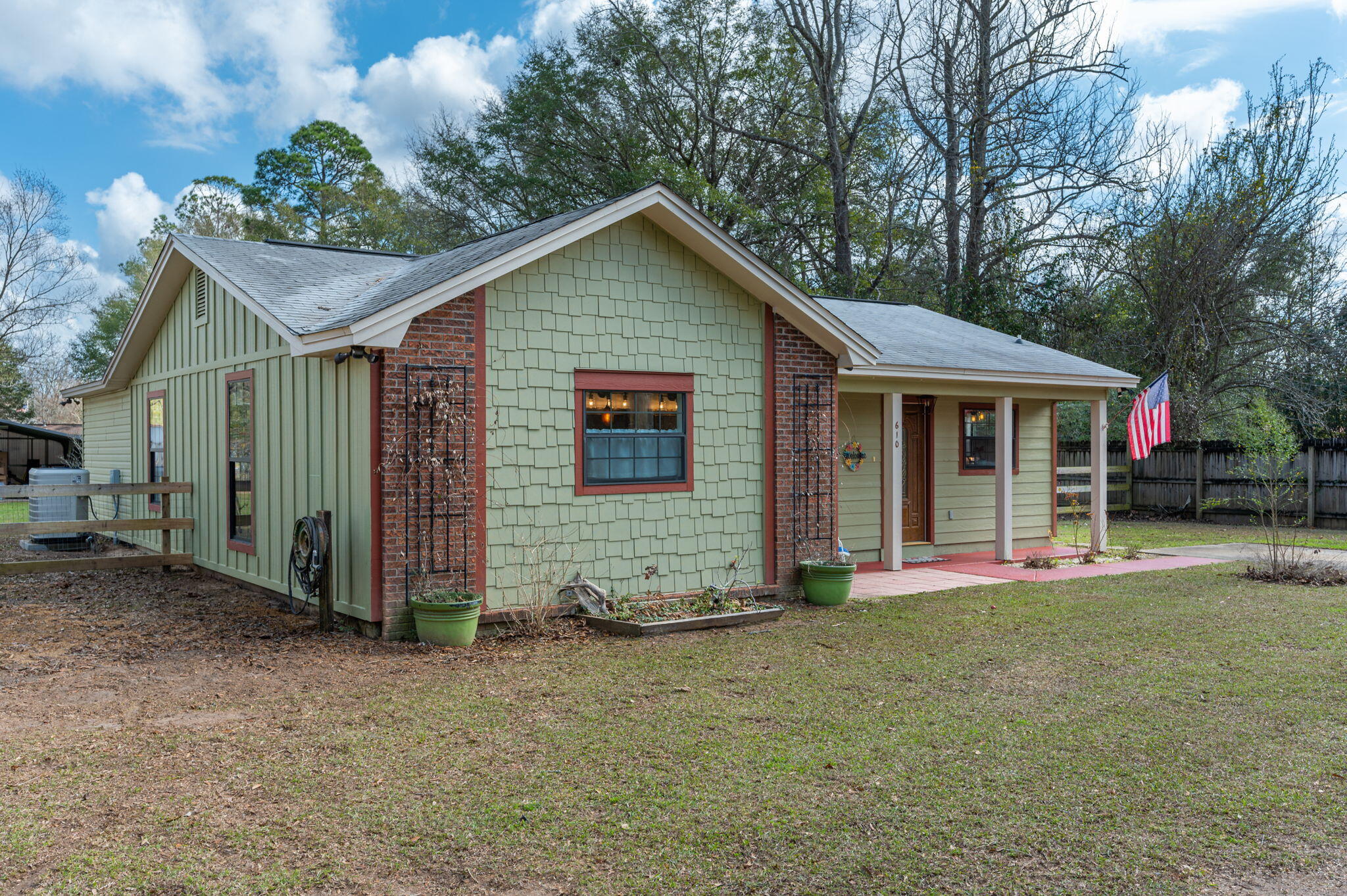 610 Jones Road Crestview, FL 32536 - Photo 2 of 39 a view of a house with a yard and large tree