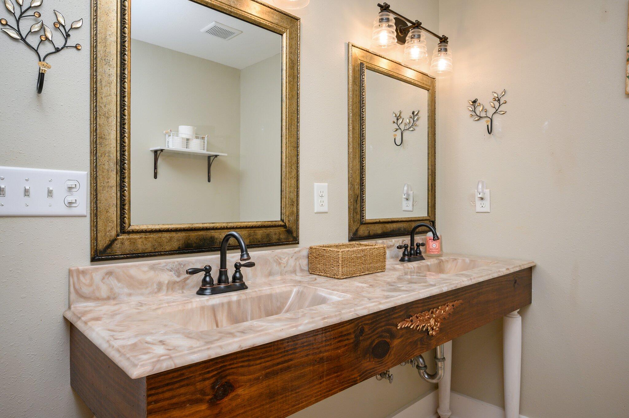 610 Jones Road Crestview, FL 32536 - Photo 21 of 39 a bathroom with a sink vanity and a mirror
