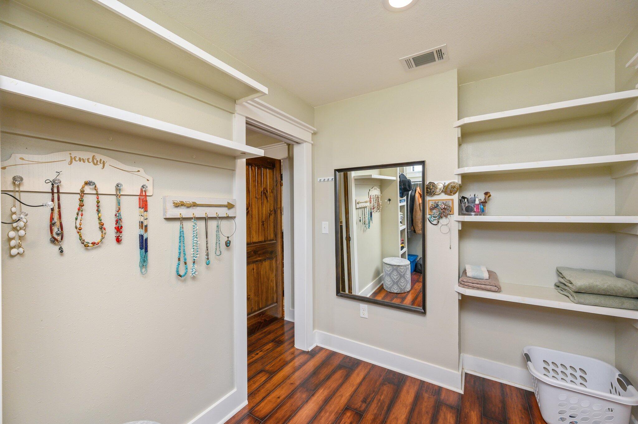 610 Jones Road Crestview, FL 32536 - Photo 22 of 39 a view of walk in closet with clothes and shoes