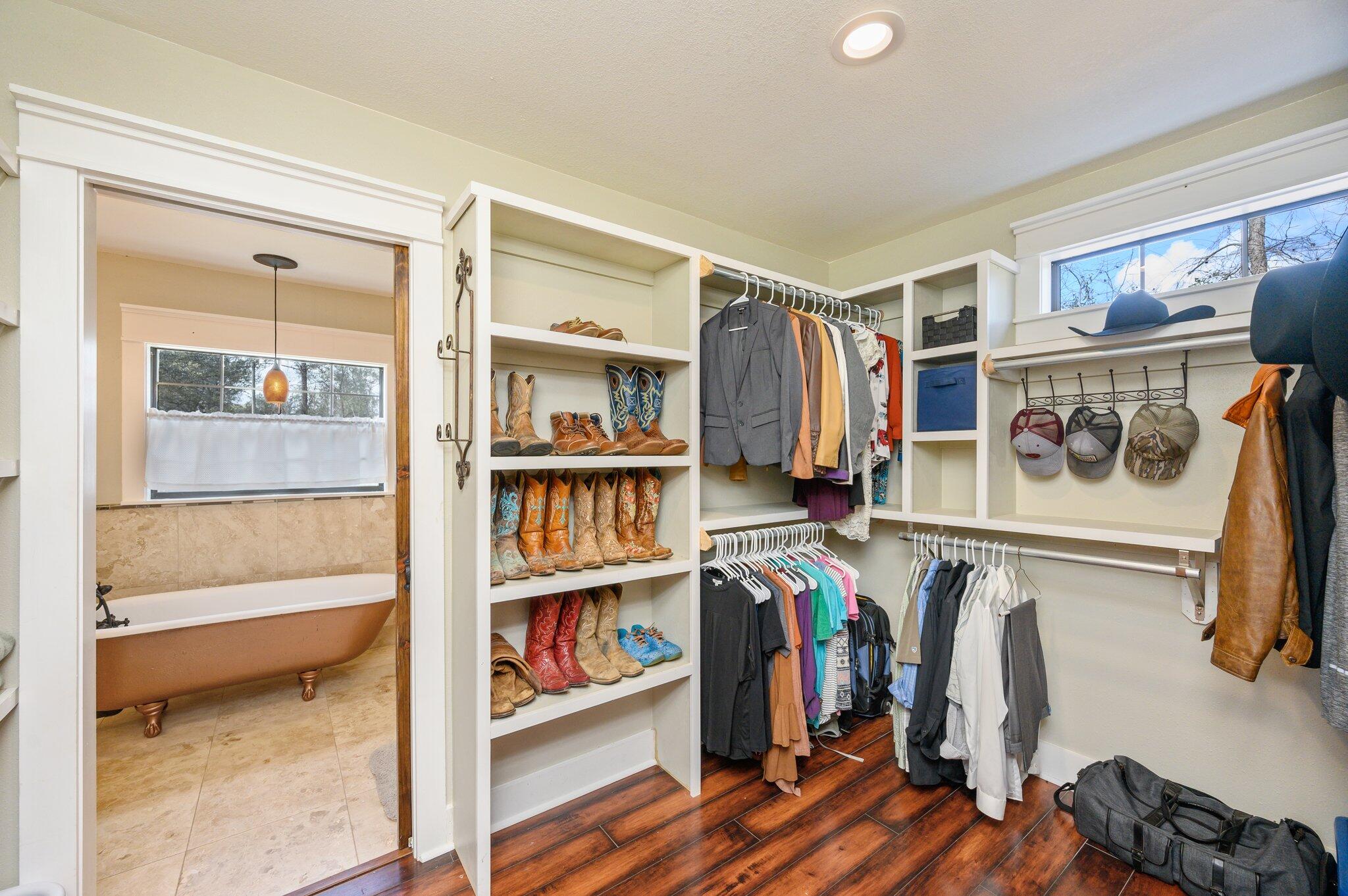 610 Jones Road Crestview, FL 32536 - Photo 23 of 39 a view of walk in closet with clothes and shoes