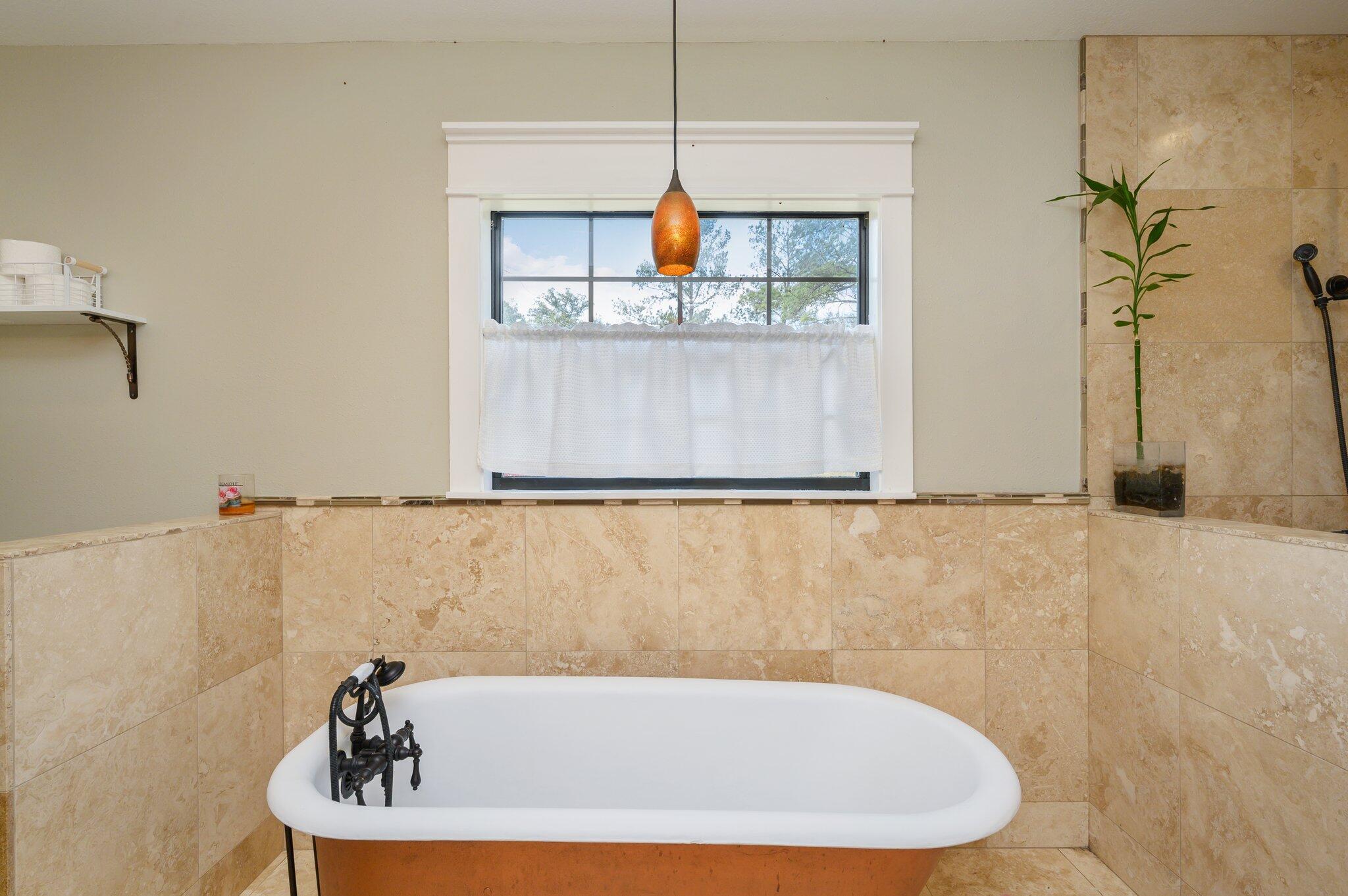 610 Jones Road Crestview, FL 32536 - Photo 26 of 39 a bathroom with a bathtub and a shower