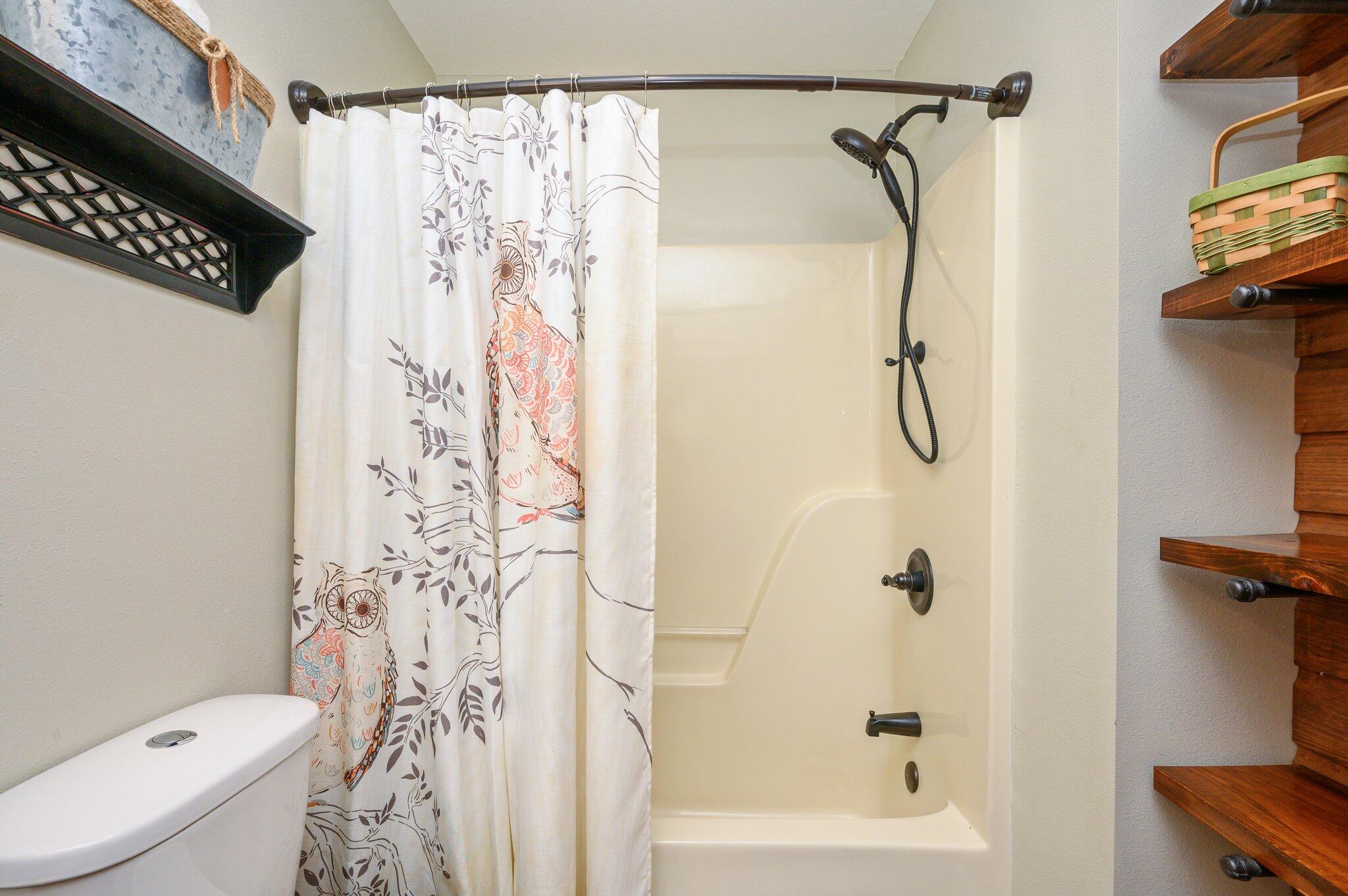 610 Jones Road Crestview, FL 32536 - Photo 33 of 39 a bathroom with a shower curtain and a toilet