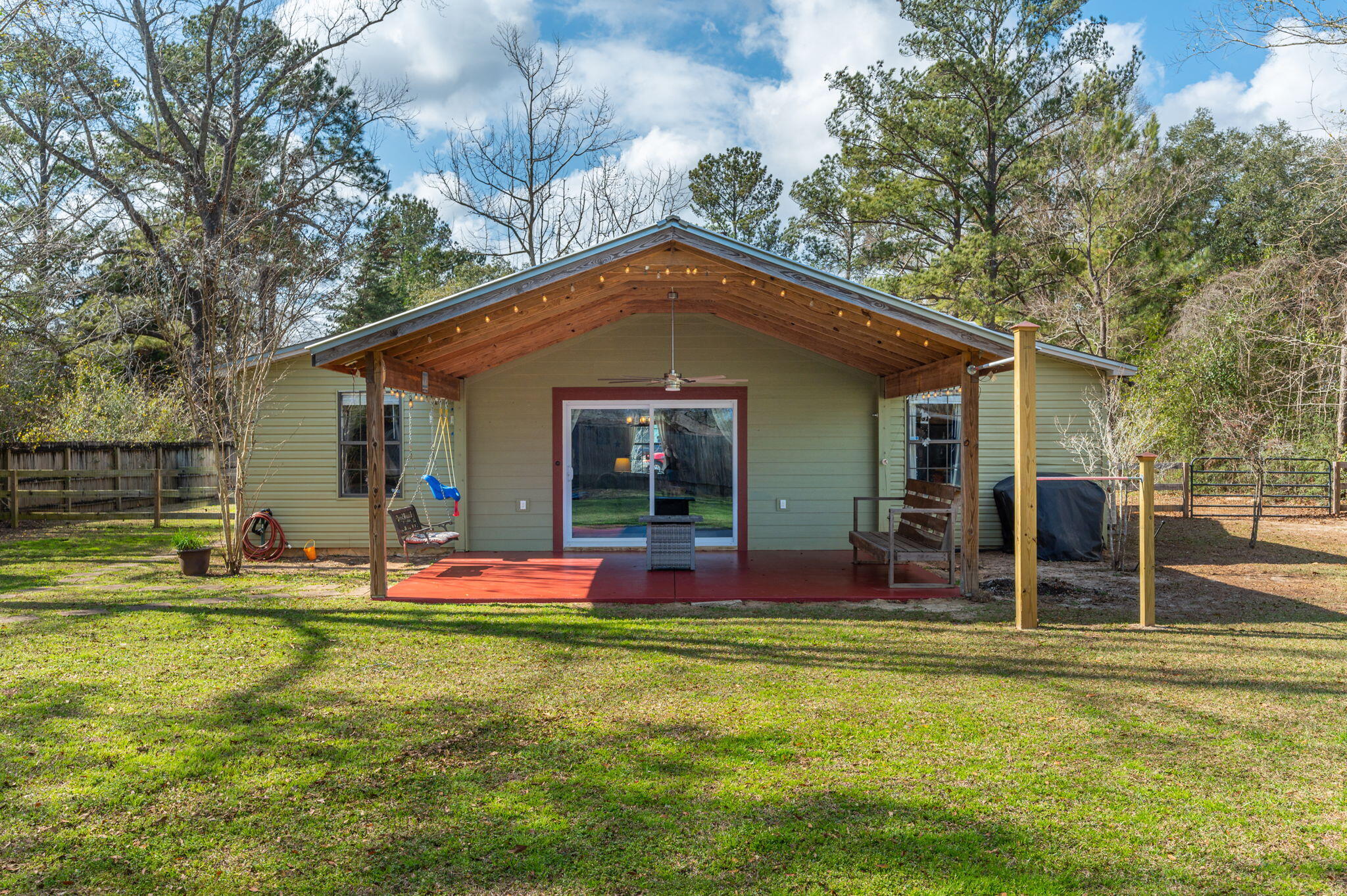 610 Jones Road Crestview, FL 32536 - Photo 34 of 39 a front view of house with outdoor seating and yard