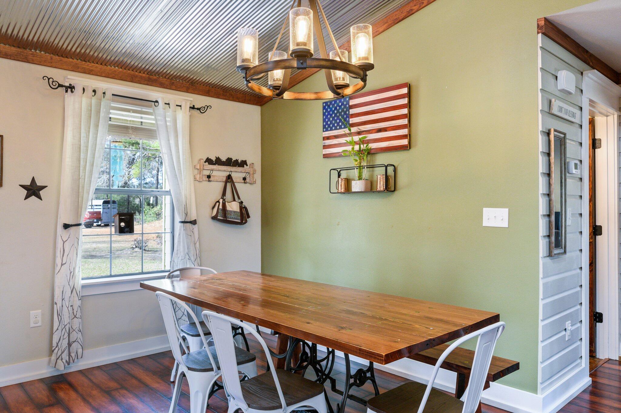 610 Jones Road Crestview, FL 32536 - Photo 8 of 39 a view of a dining room with furniture and wooden floor