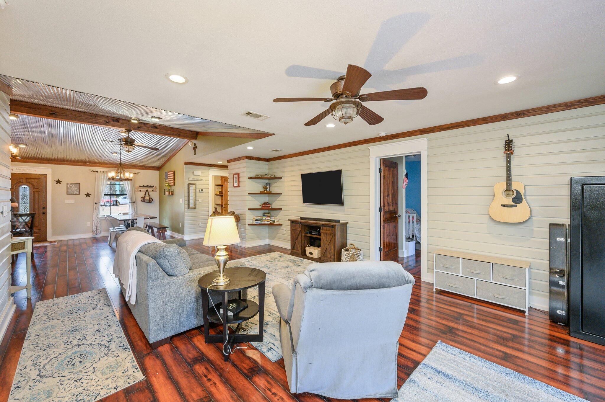 610 Jones Road Crestview, FL 32536 - Photo 9 of 39 a living room with fireplace furniture and a flat screen tv