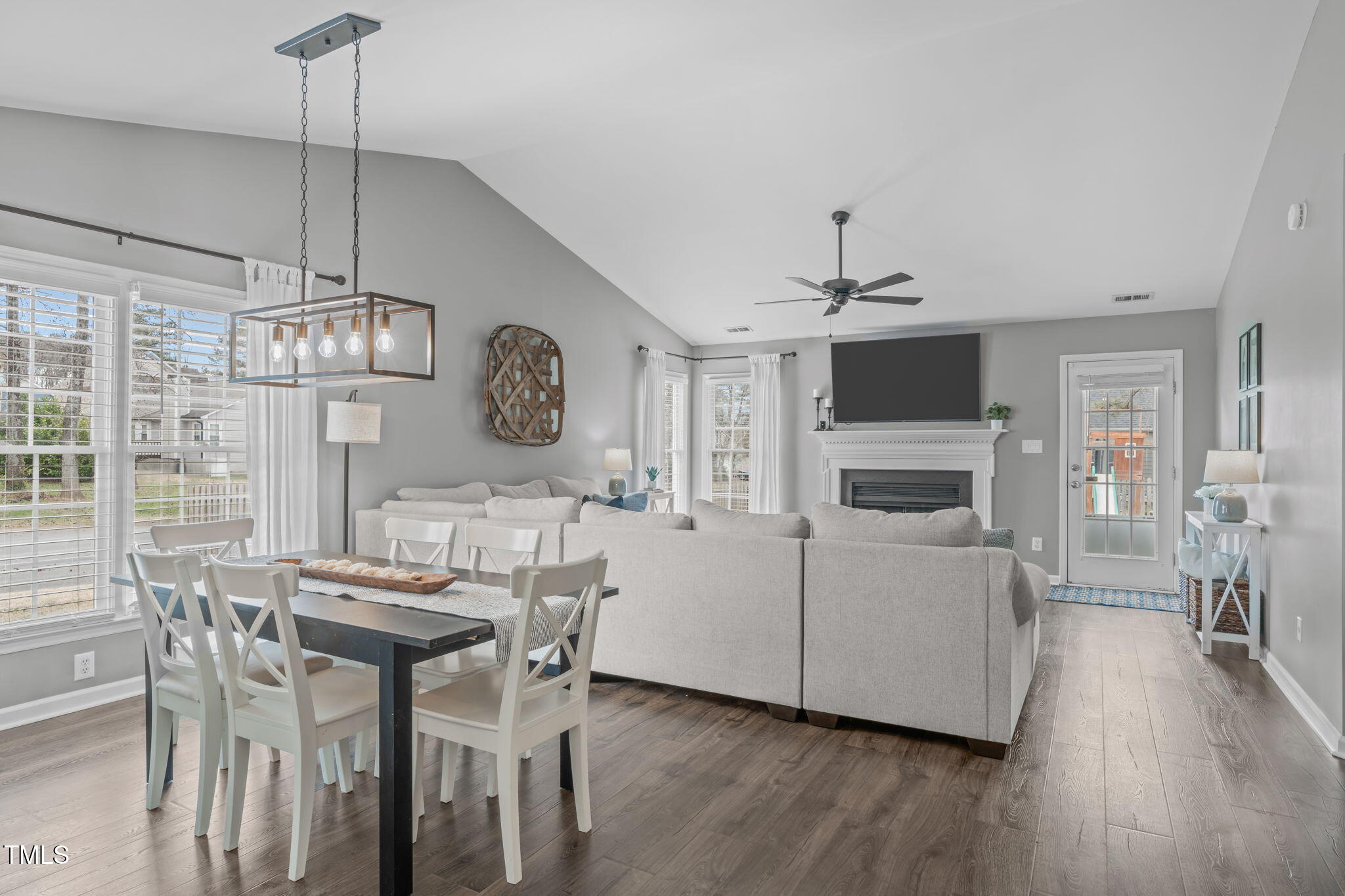 11228 North Radner Way Raleigh, NC 27613 - Photo 11 of 34 a view of a dining room with furniture a chandelier and wooden floor