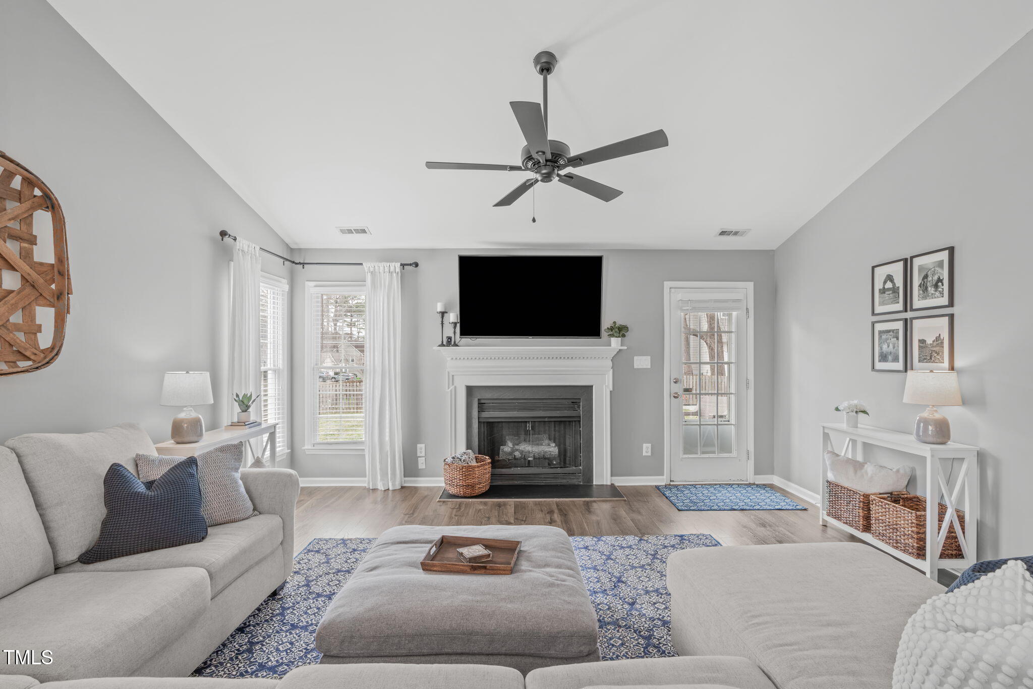 11228 North Radner Way Raleigh, NC 27613 - Photo 13 of 34 a living room with furniture a window and a fireplace