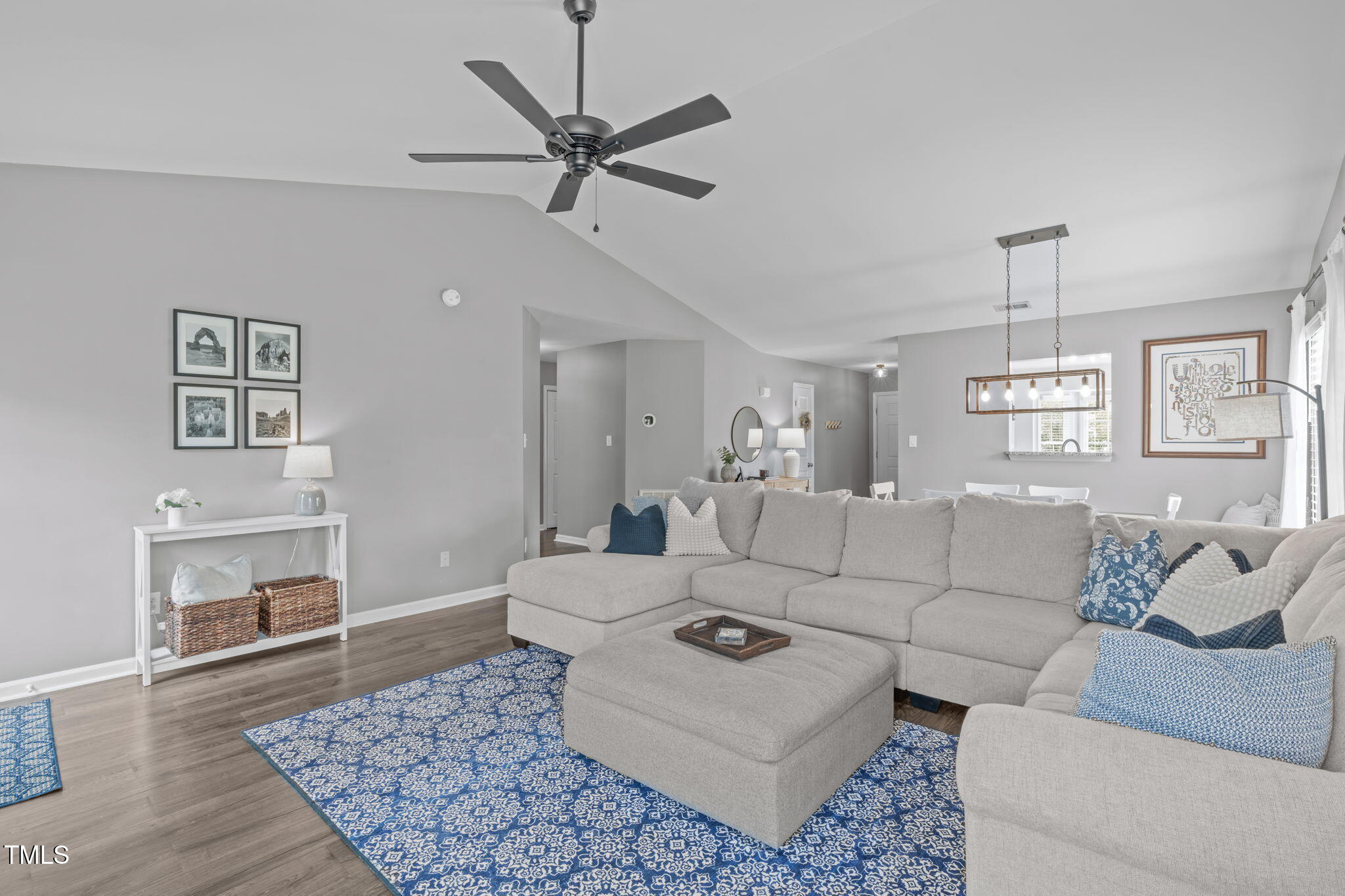 11228 North Radner Way Raleigh, NC 27613 - Photo 16 of 34 a living room with furniture and a chandelier