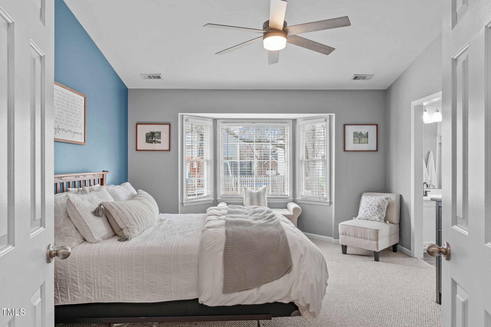11228 North Radner Way Raleigh, NC 27613 - Photo 17 of 34 a bedroom with a bed couch and window