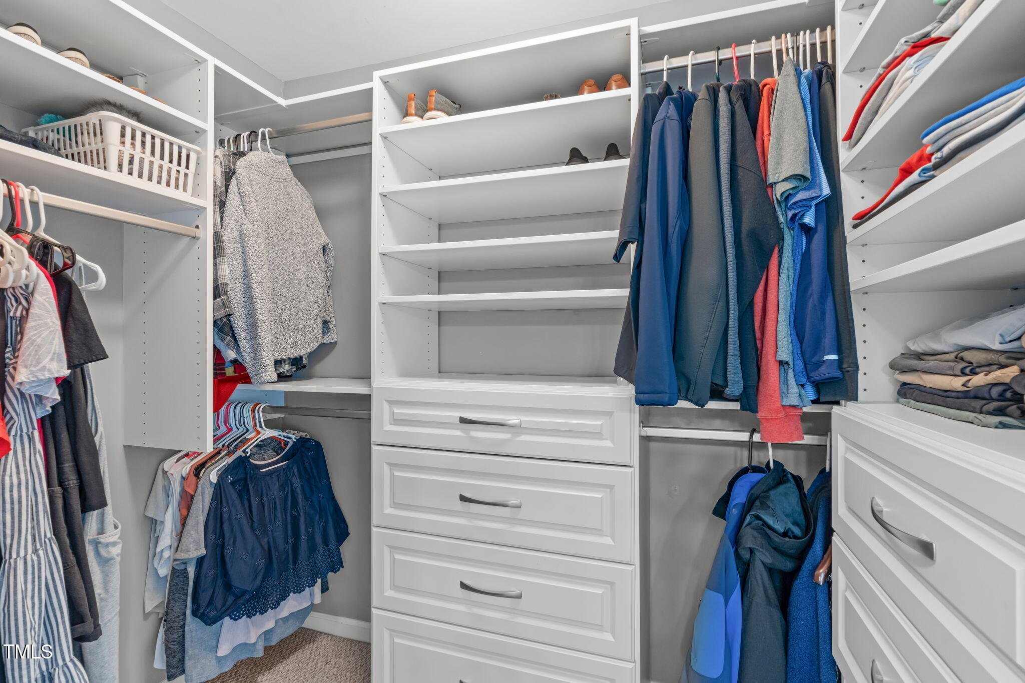 11228 North Radner Way Raleigh, NC 27613 - Photo 22 of 34 a view of walk in closet with clothes and shoes