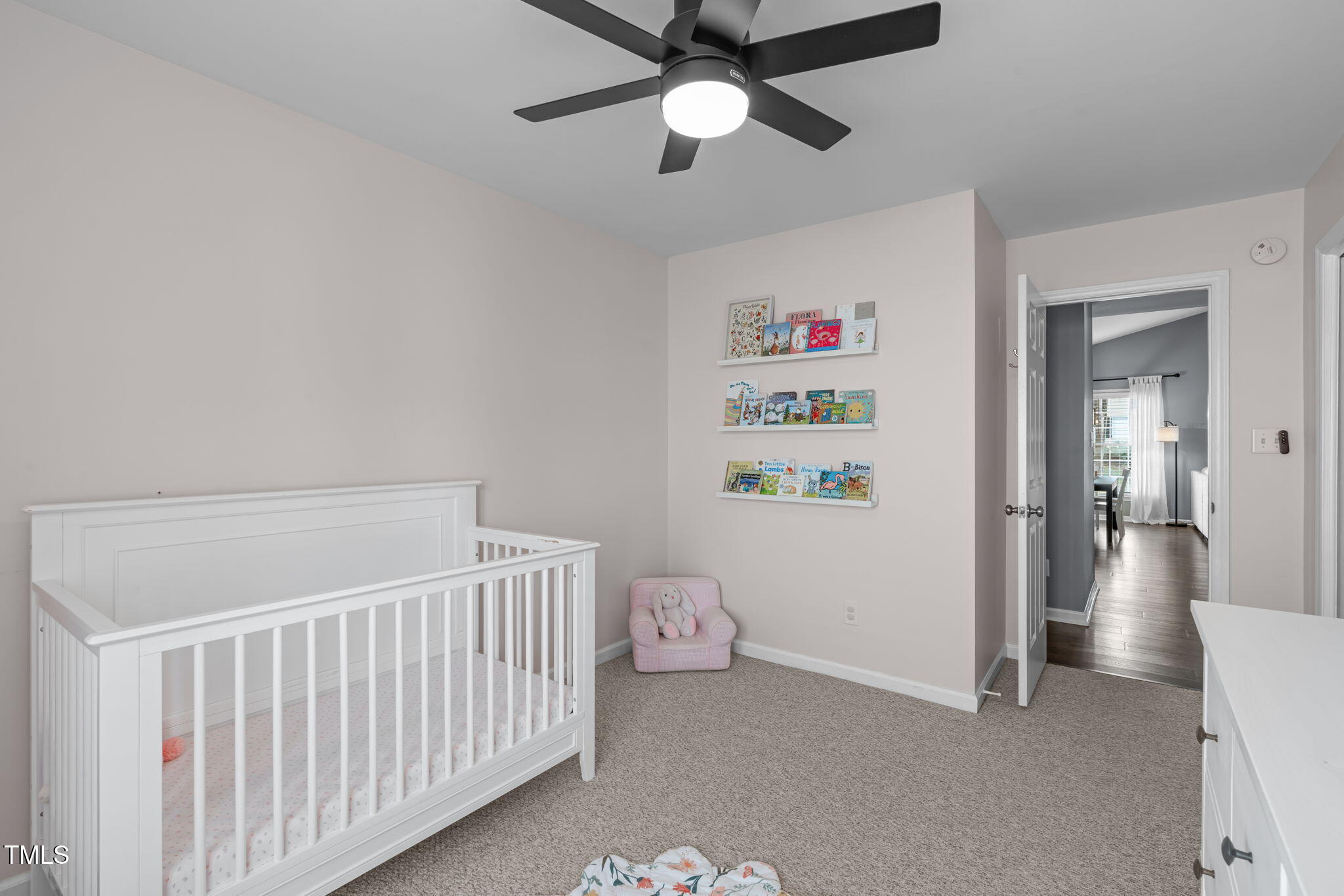 11228 North Radner Way Raleigh, NC 27613 - Photo 24 of 34 a bedroom with a bed and a chandelier