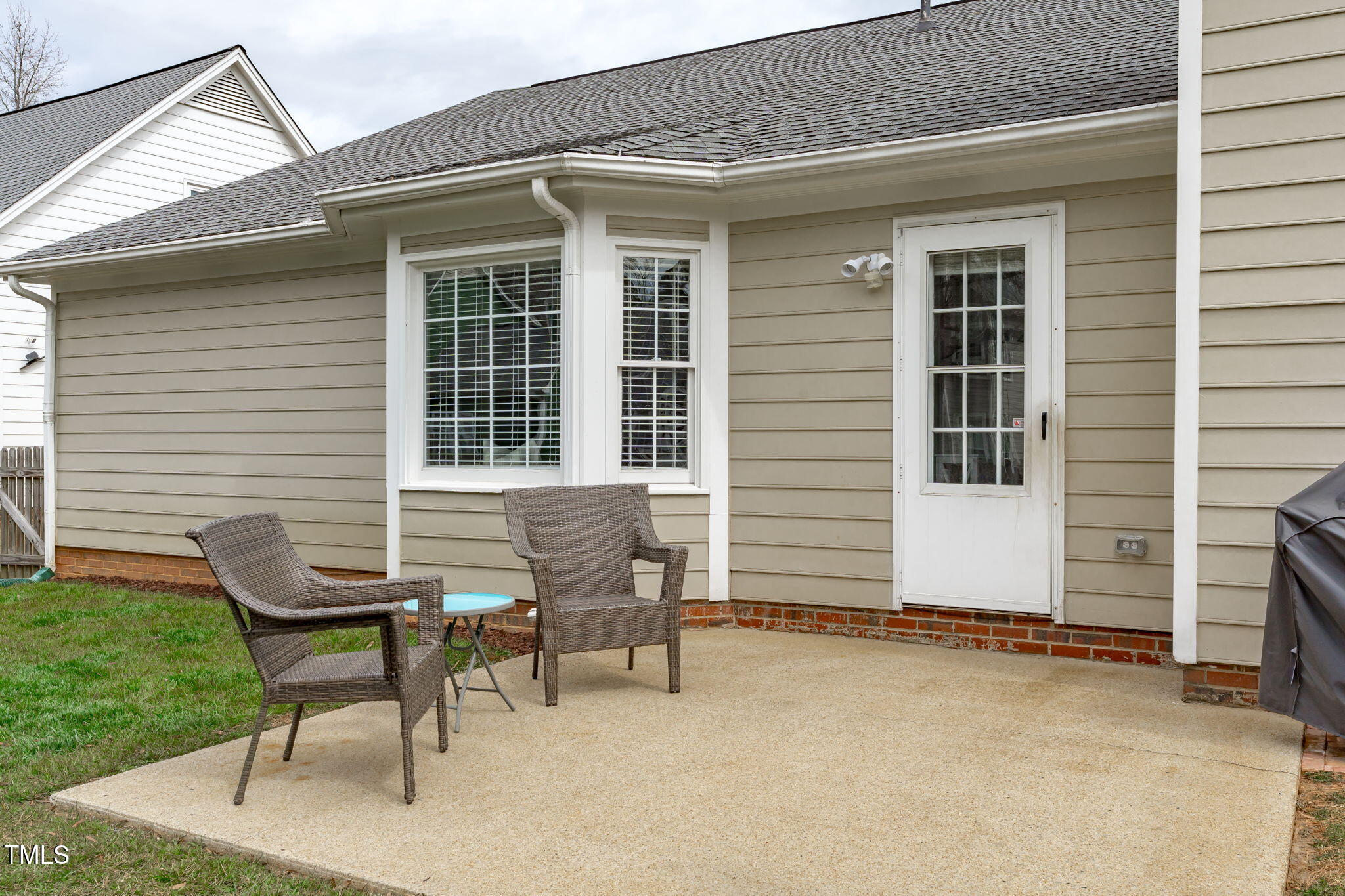 11228 North Radner Way Raleigh, NC 27613 - Photo 28 of 34 a view of a house with a yard and sitting area
