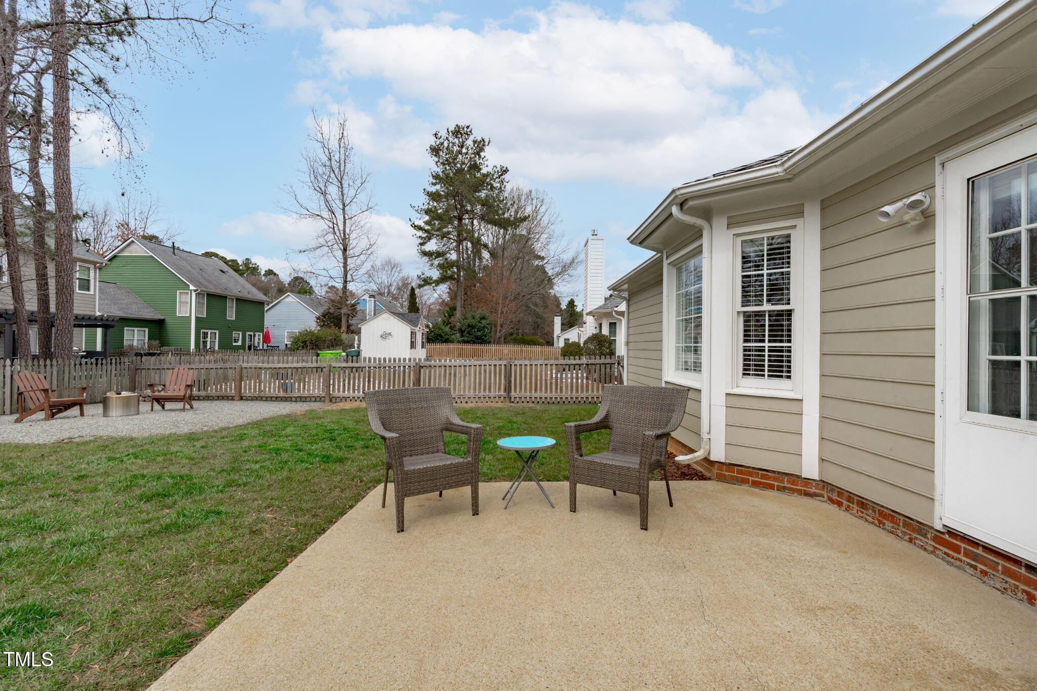 11228 North Radner Way Raleigh, NC 27613 - Photo 29 of 34 a view of a house with backyard sitting area and garden