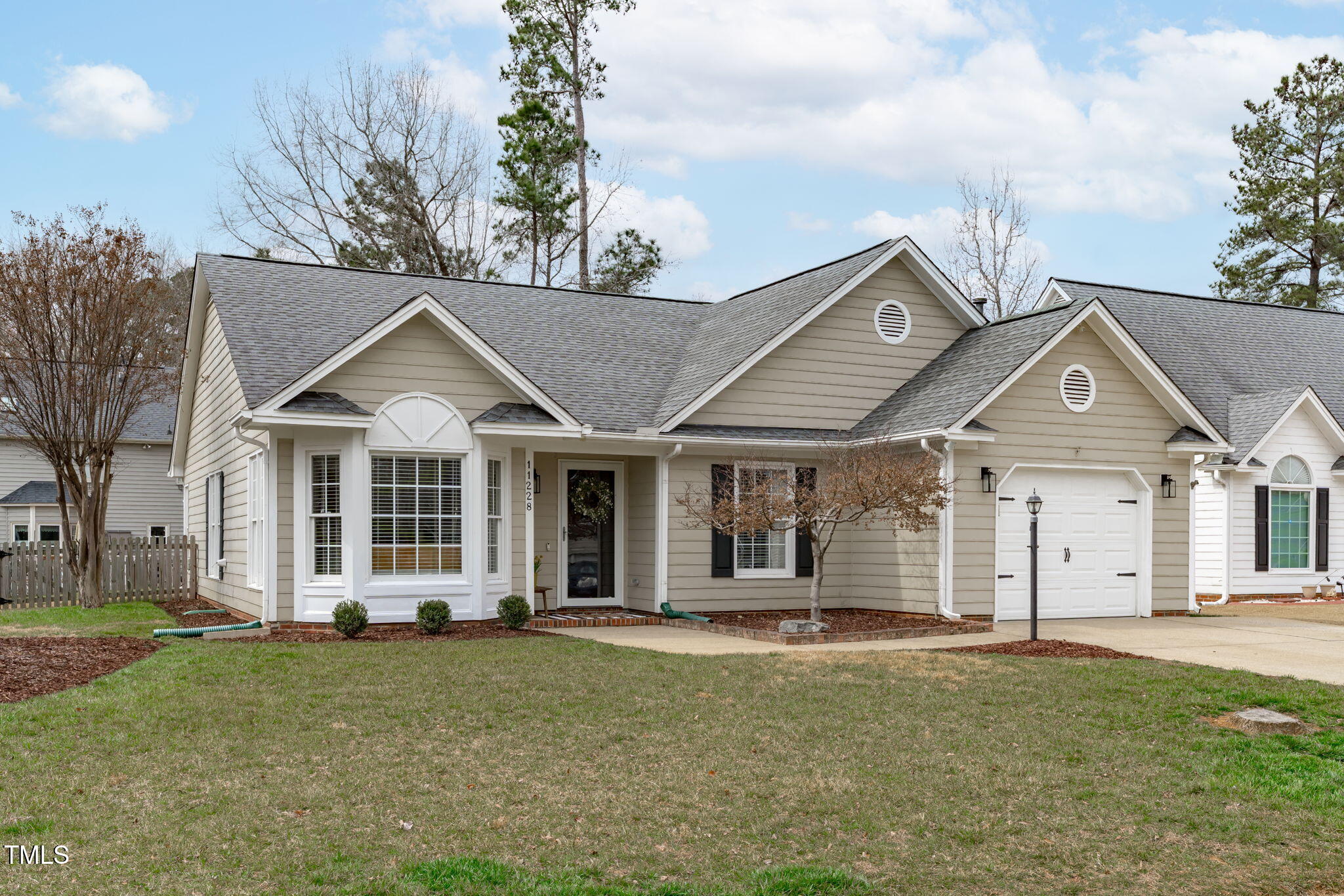11228 North Radner Way Raleigh, NC 27613 - Photo 2 of 34 front view of a house with a yard