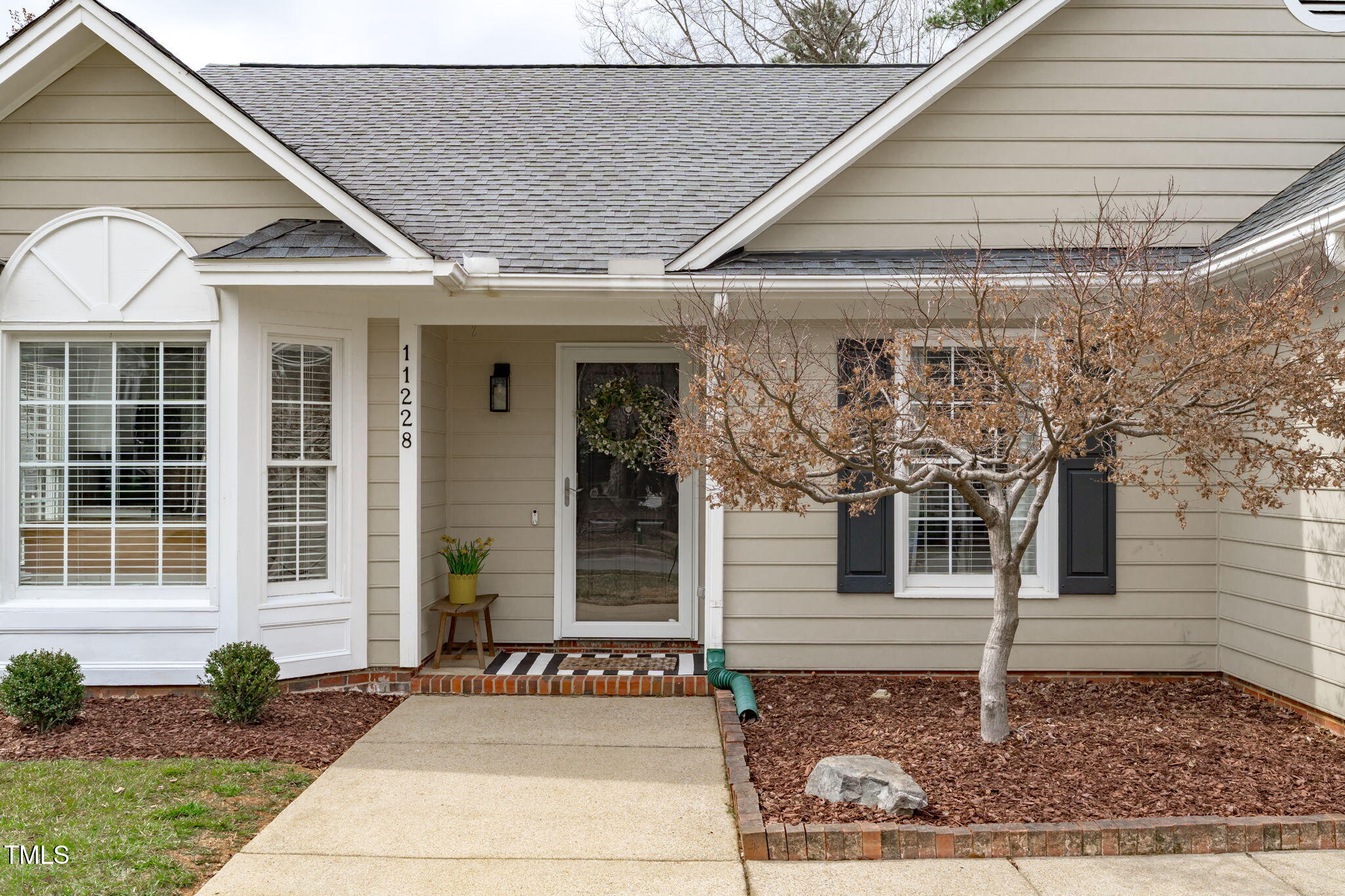 11228 North Radner Way Raleigh, NC 27613 - Photo 3 of 34 a front view of a house