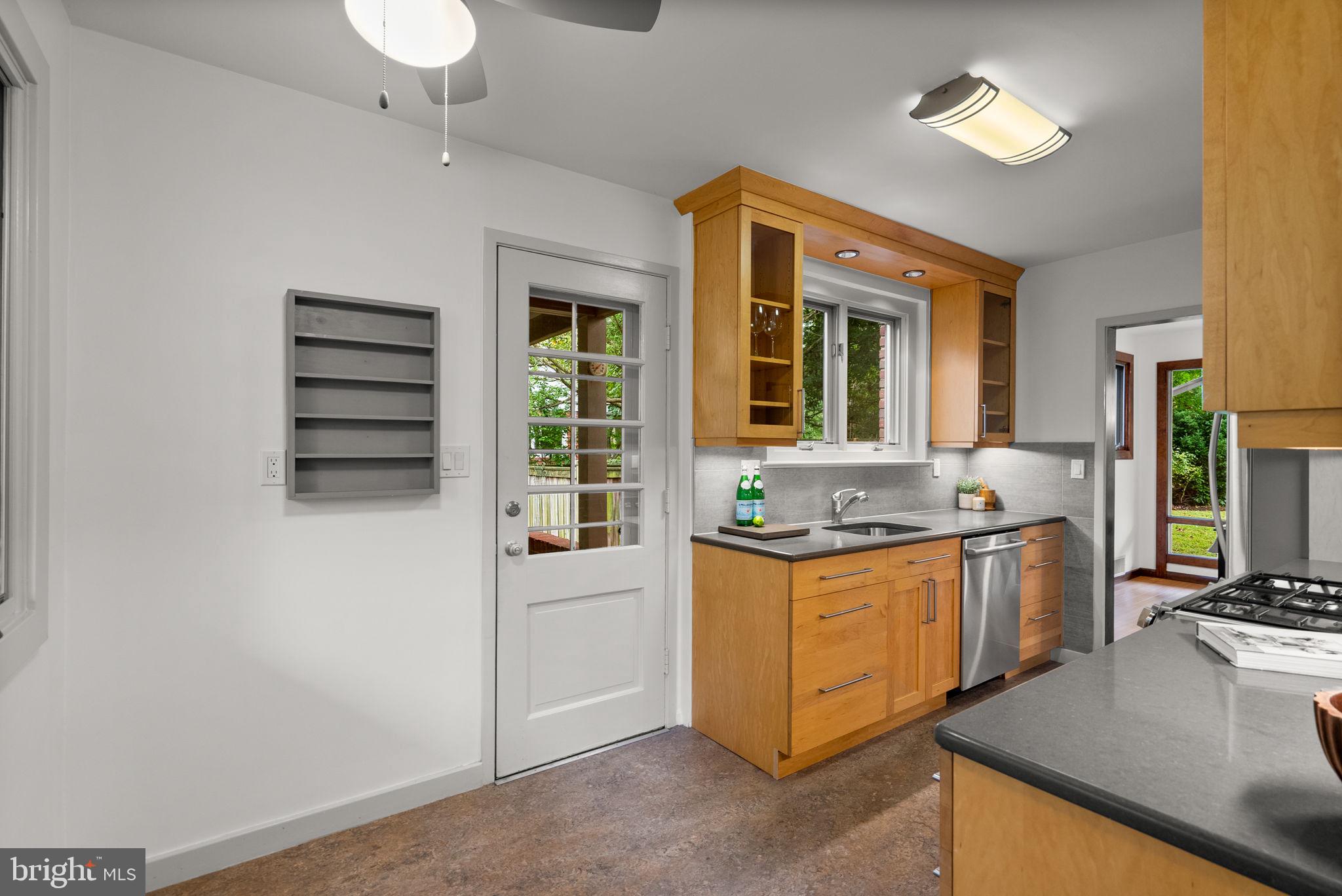 9109 Fairview Road Silver Spring, MD 20910 - Photo 18 of 46 a kitchen with stainless steel appliances granite countertop a stove and a sink