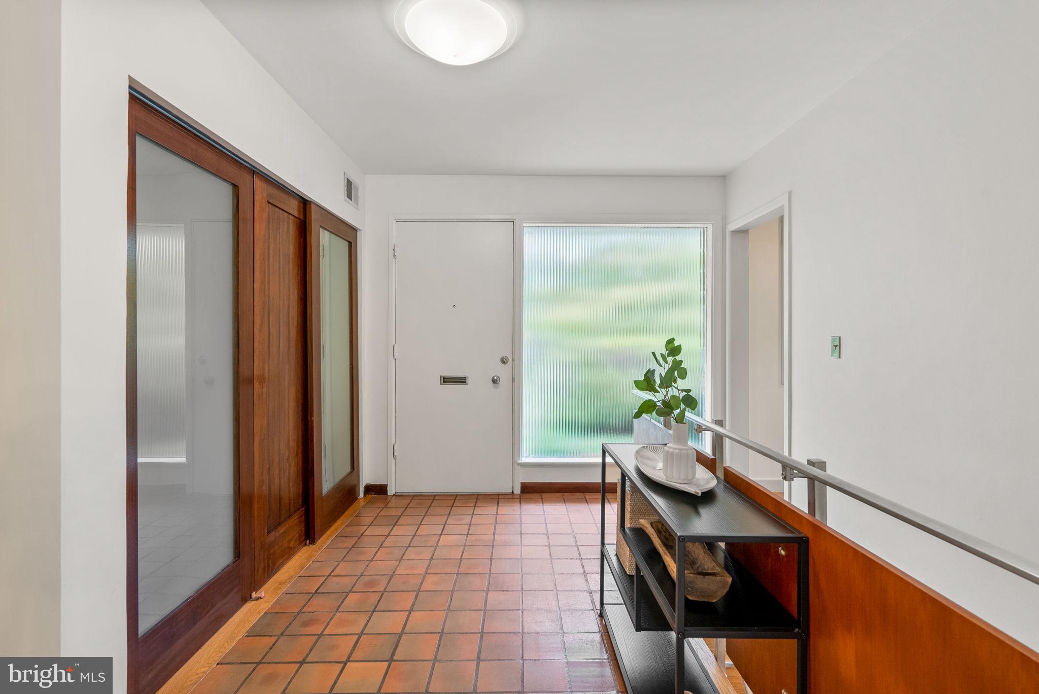 9109 Fairview Road Silver Spring, MD 20910 - Photo 3 of 46 a very nice looking room with a potted plant